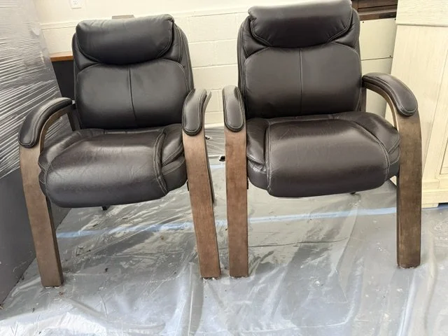 two black leather chairs.jpeg