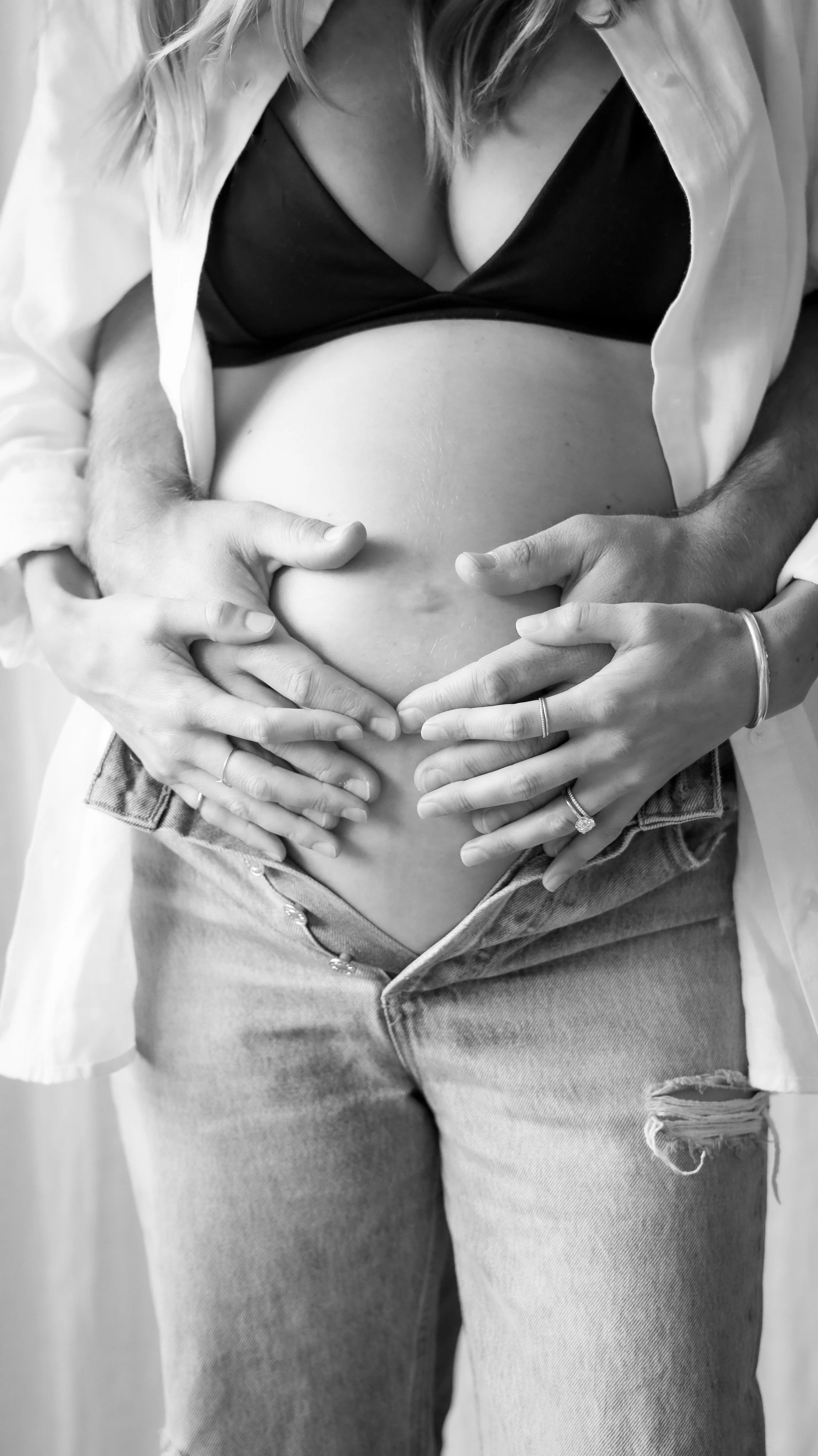 Celebrate the Middleton's journey into parenthood with stunning maternity photography at Realm Studio in Denver, CO, expertly captured by Nicole Schmiedl.