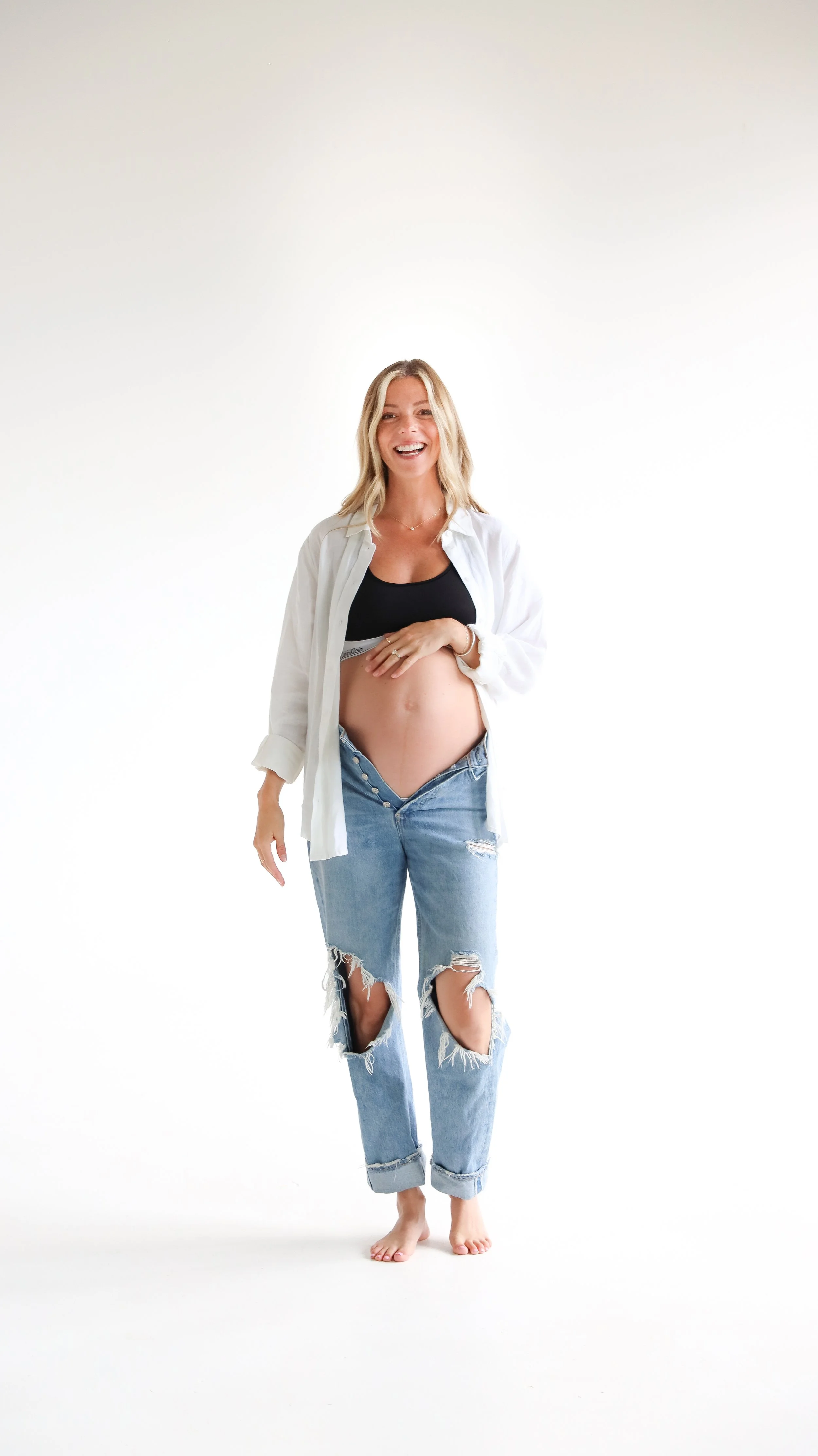 Celebrate the Middleton's journey into parenthood with stunning maternity photography at Realm Studio in Denver, CO, expertly captured by Nicole Schmiedl.