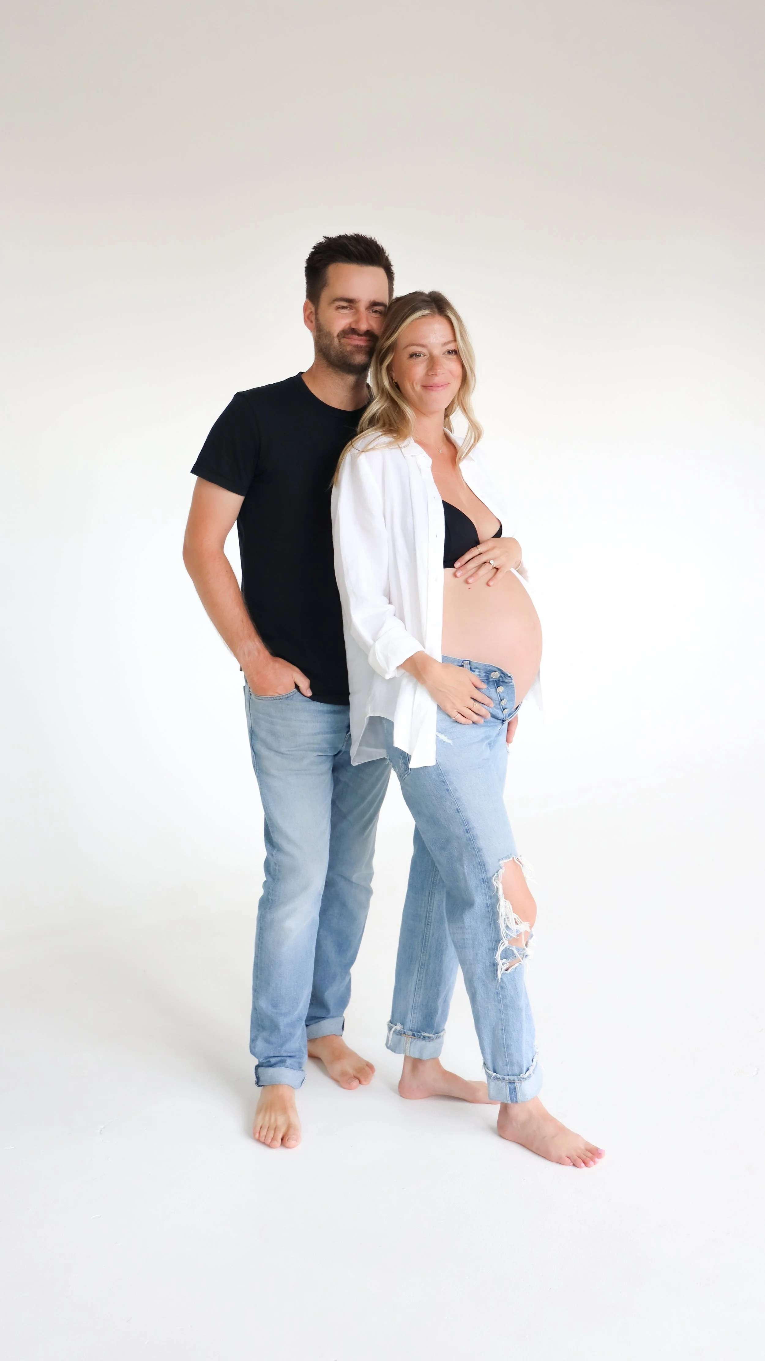 Celebrate the Middleton's journey into parenthood with stunning maternity photography at Realm Studio in Denver, CO, expertly captured by Nicole Schmiedl.