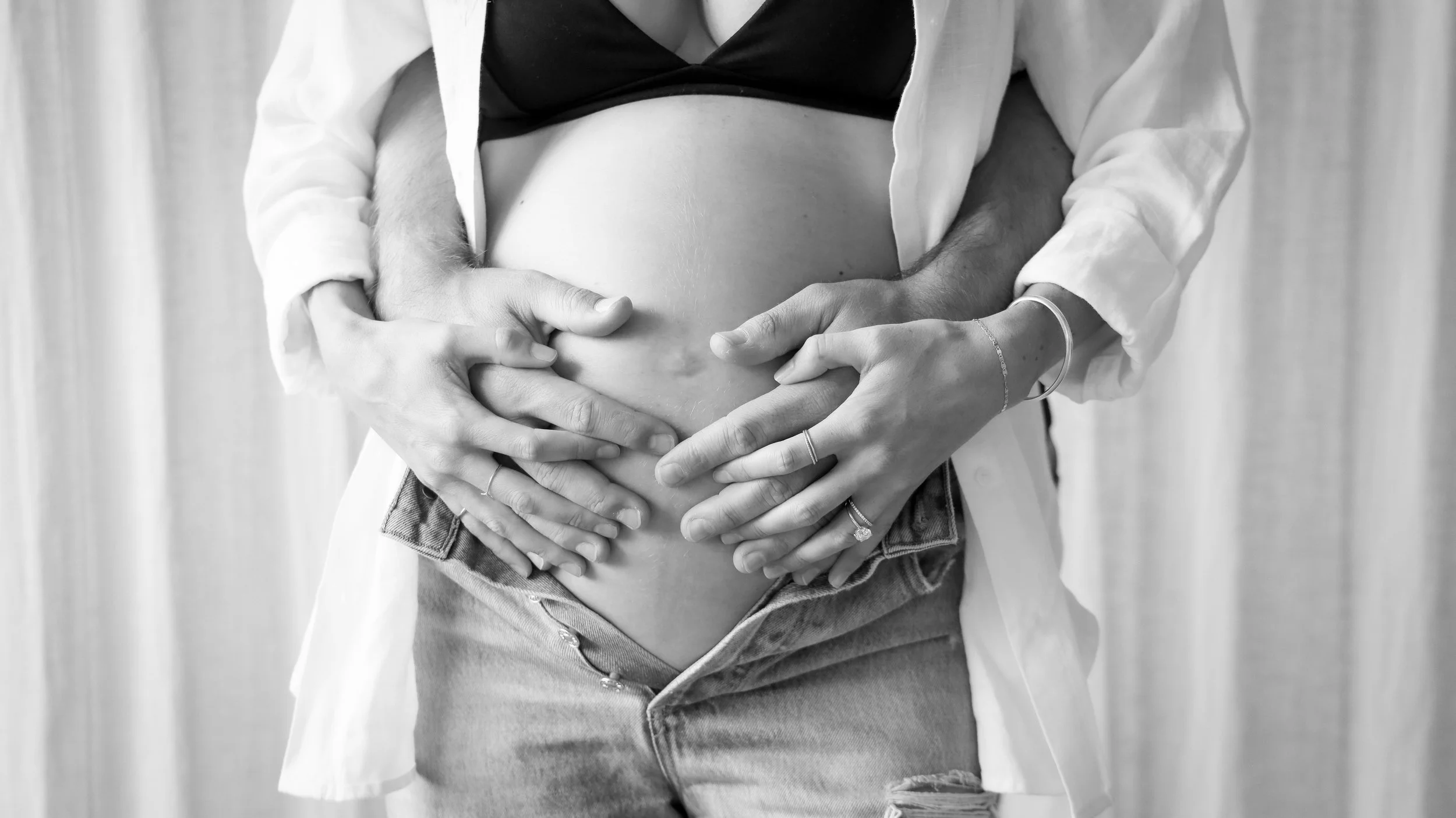 Celebrate the Middleton's journey into parenthood with stunning maternity photography at Realm Studio in Denver, CO, expertly captured by Nicole Schmiedl.