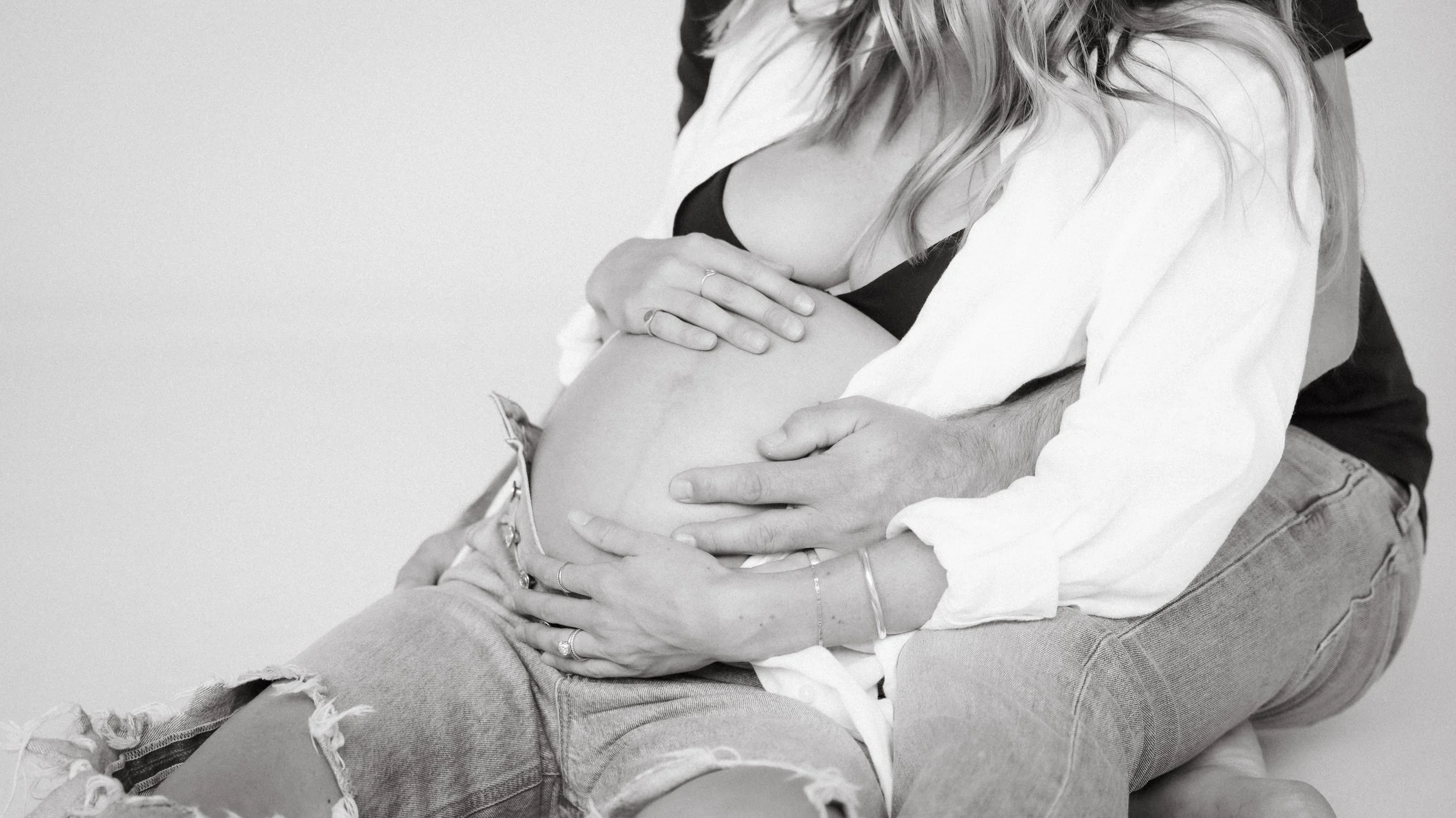 Celebrate the Middleton's journey into parenthood with stunning maternity photography at Realm Studio in Denver, CO, expertly captured by Nicole Schmiedl.
