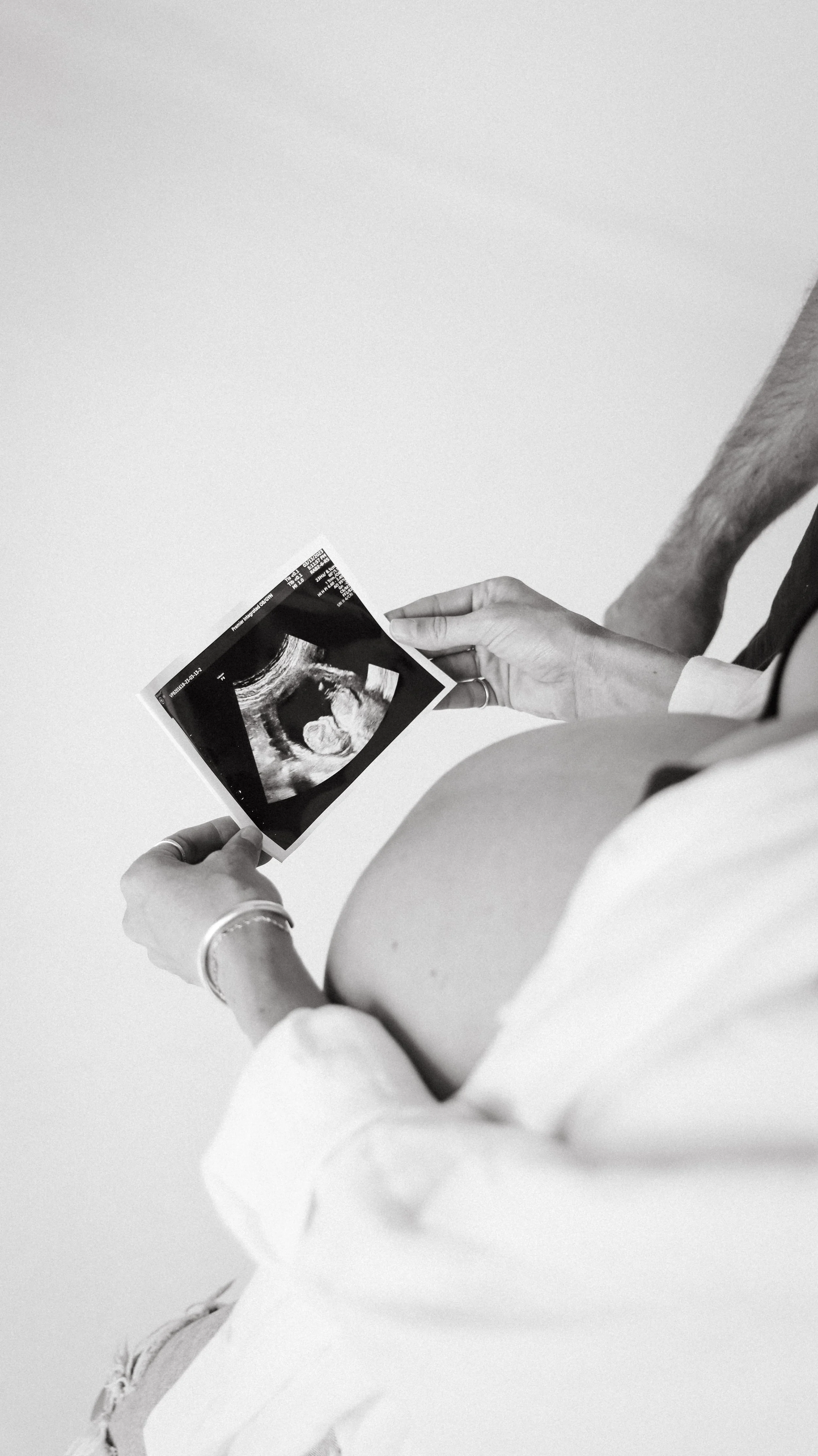 Celebrate the Middleton's journey into parenthood with stunning maternity photography at Realm Studio in Denver, CO, expertly captured by Nicole Schmiedl.