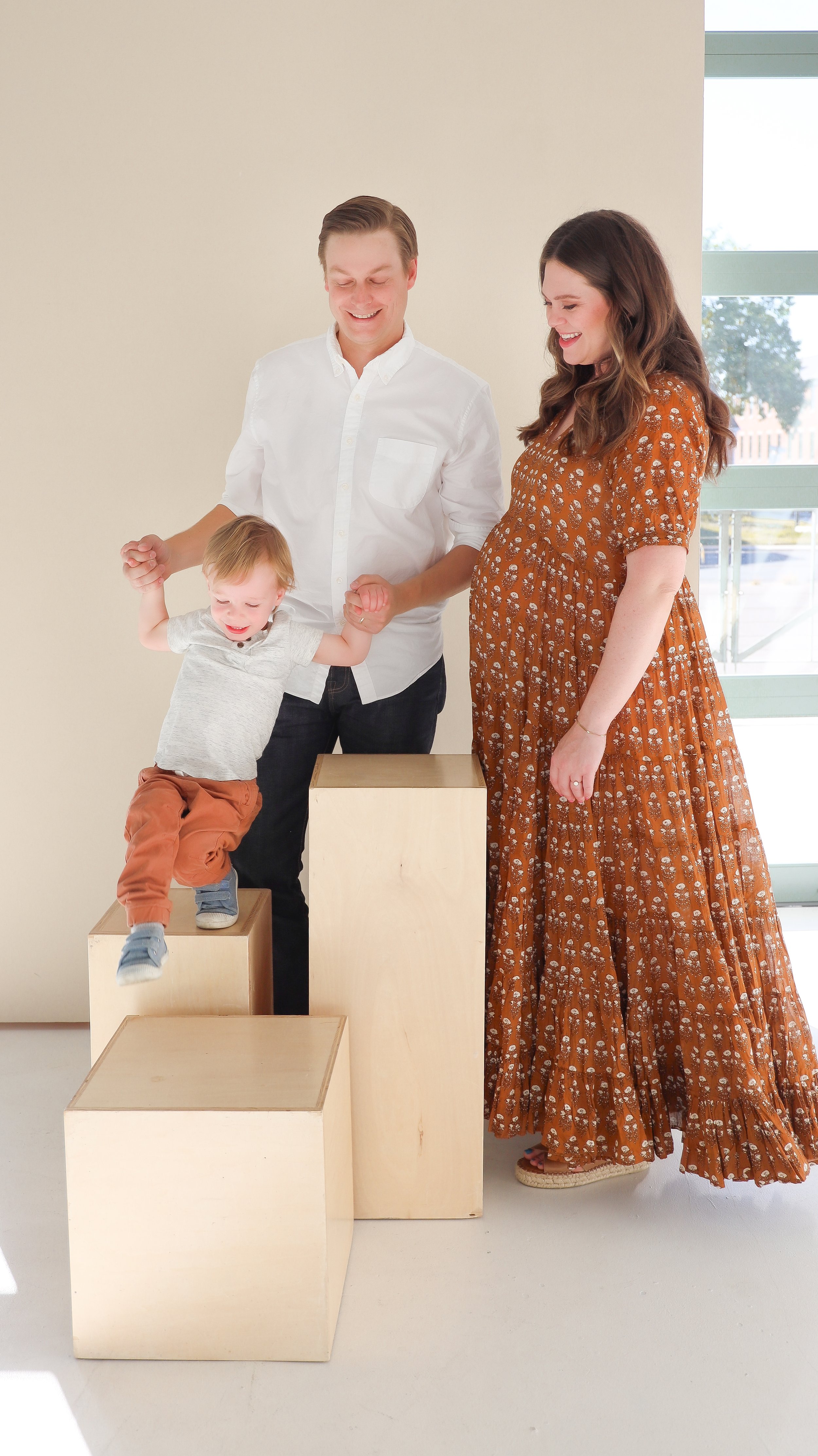 Youngblade family, captured in beautiful maternity photos, eagerly expanding to four. Precious moments in family and maternity photography."