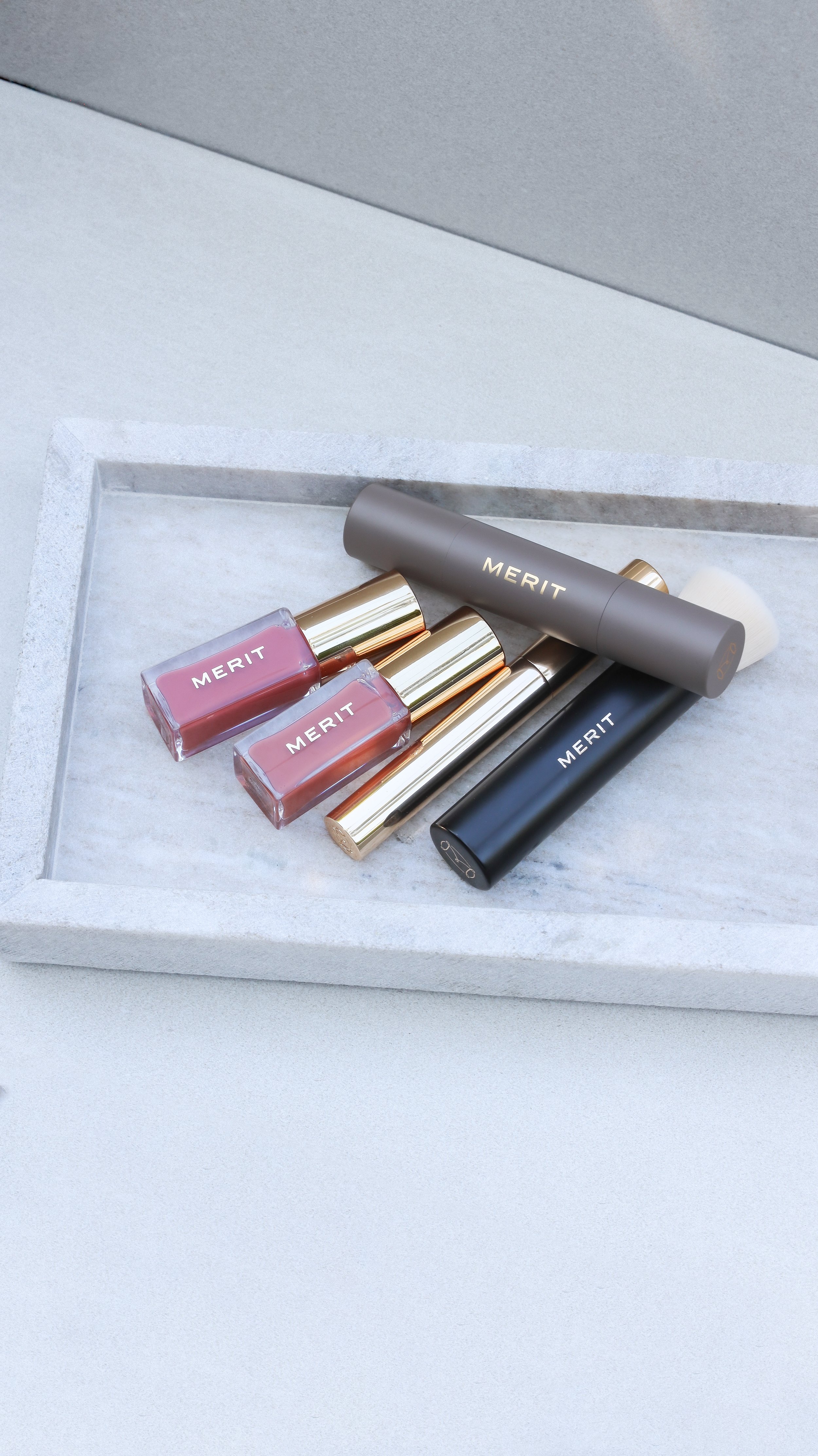 Merit Beauty lip stain, brow gel, concealer and blending brush by Nicole Schmiedl