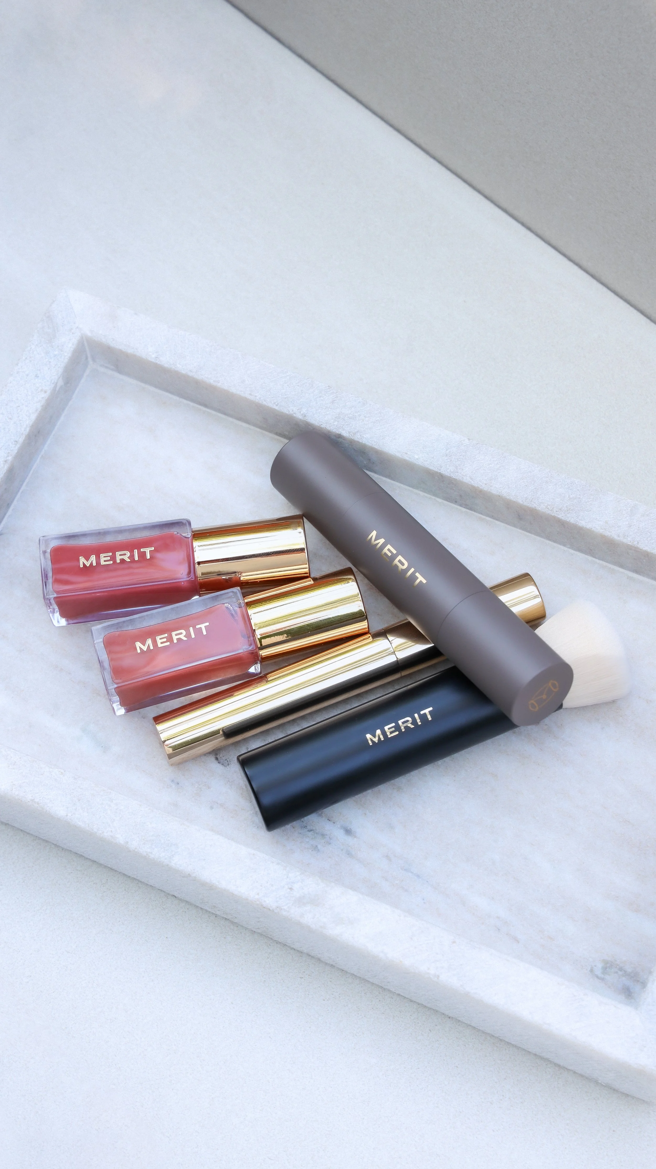 Merit Beauty lip stain, brow gel, concealer and blending brush by Nicole Schmiedl