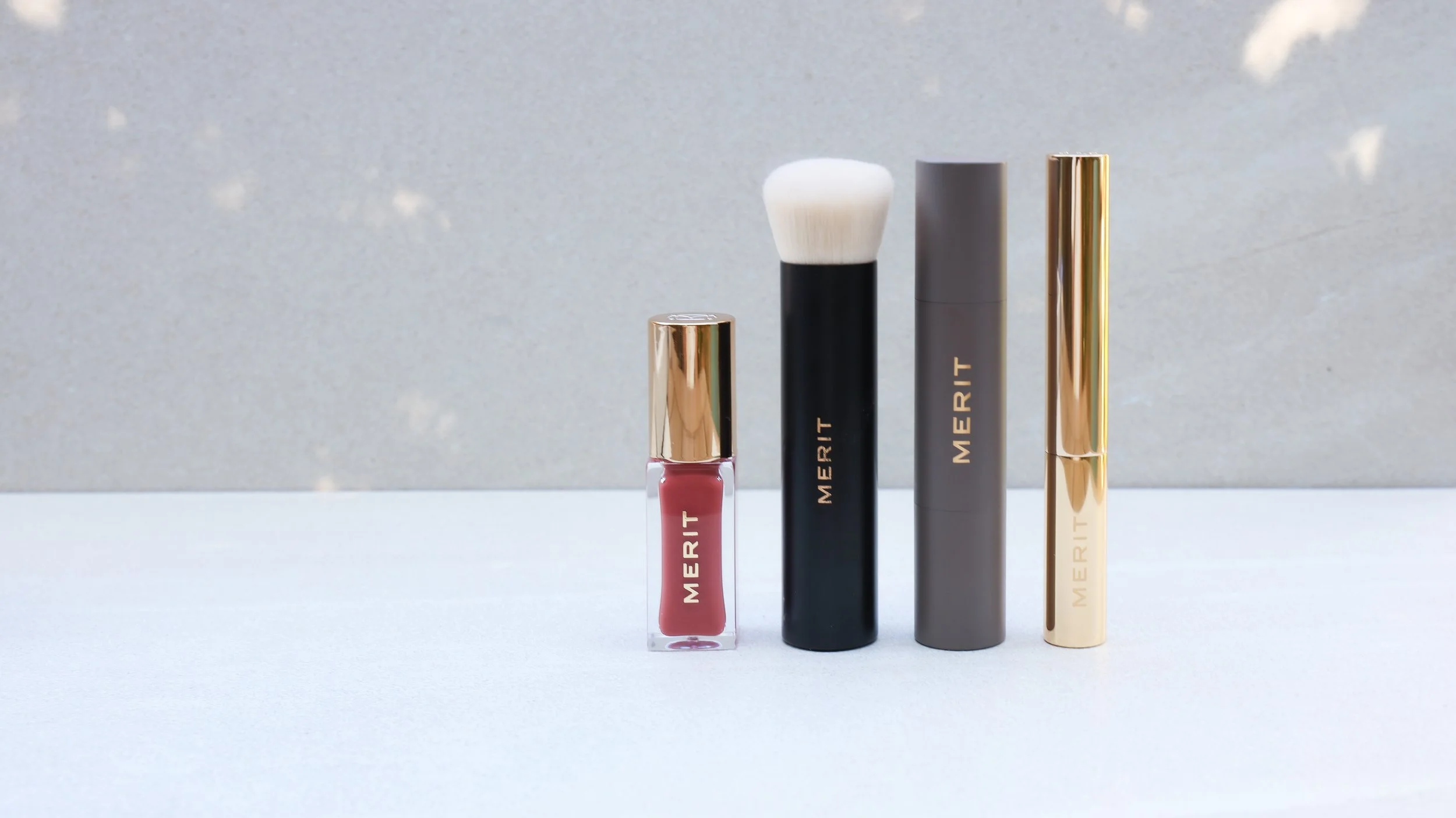 Merit Beauty lip stain, brow gel, concealer and blending brush by Nicole Schmiedl