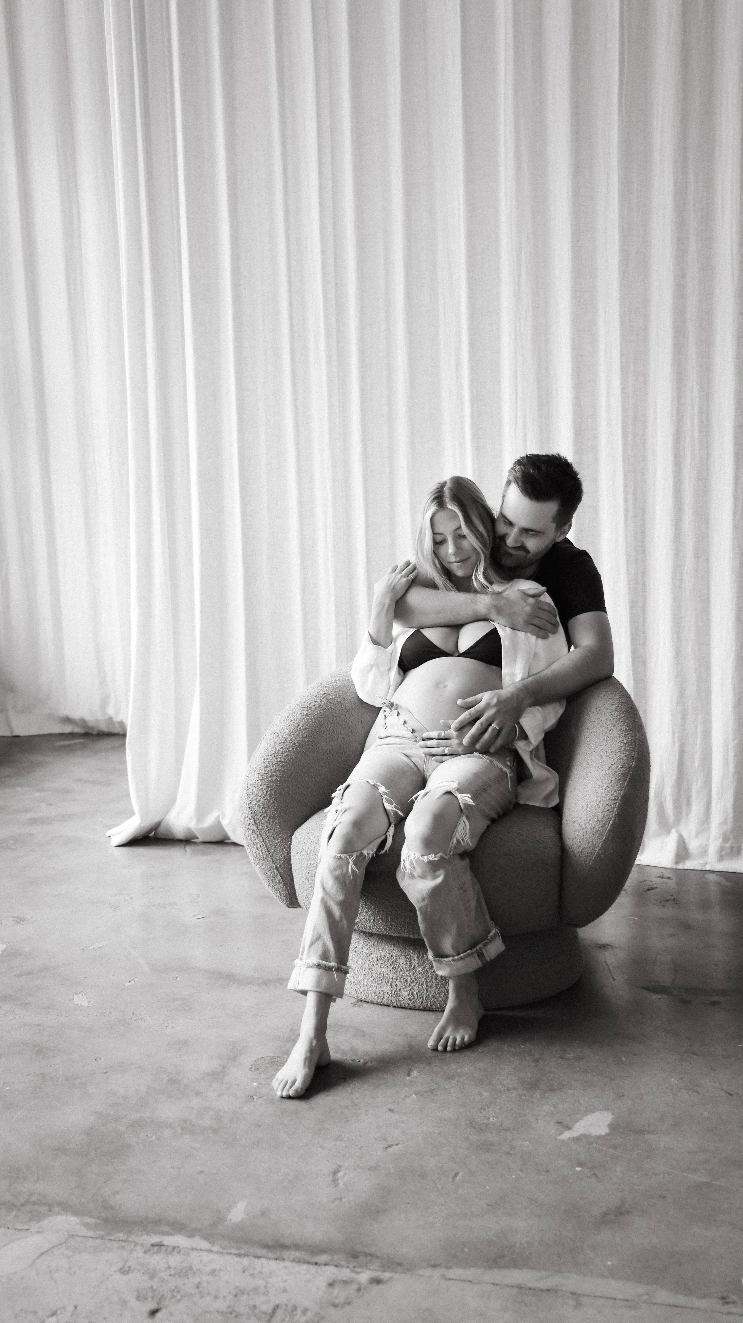 Celebrate the Middleton's journey into parenthood with stunning maternity photography at Realm Studio in Denver, CO, expertly captured by Nicole Schmiedl.
