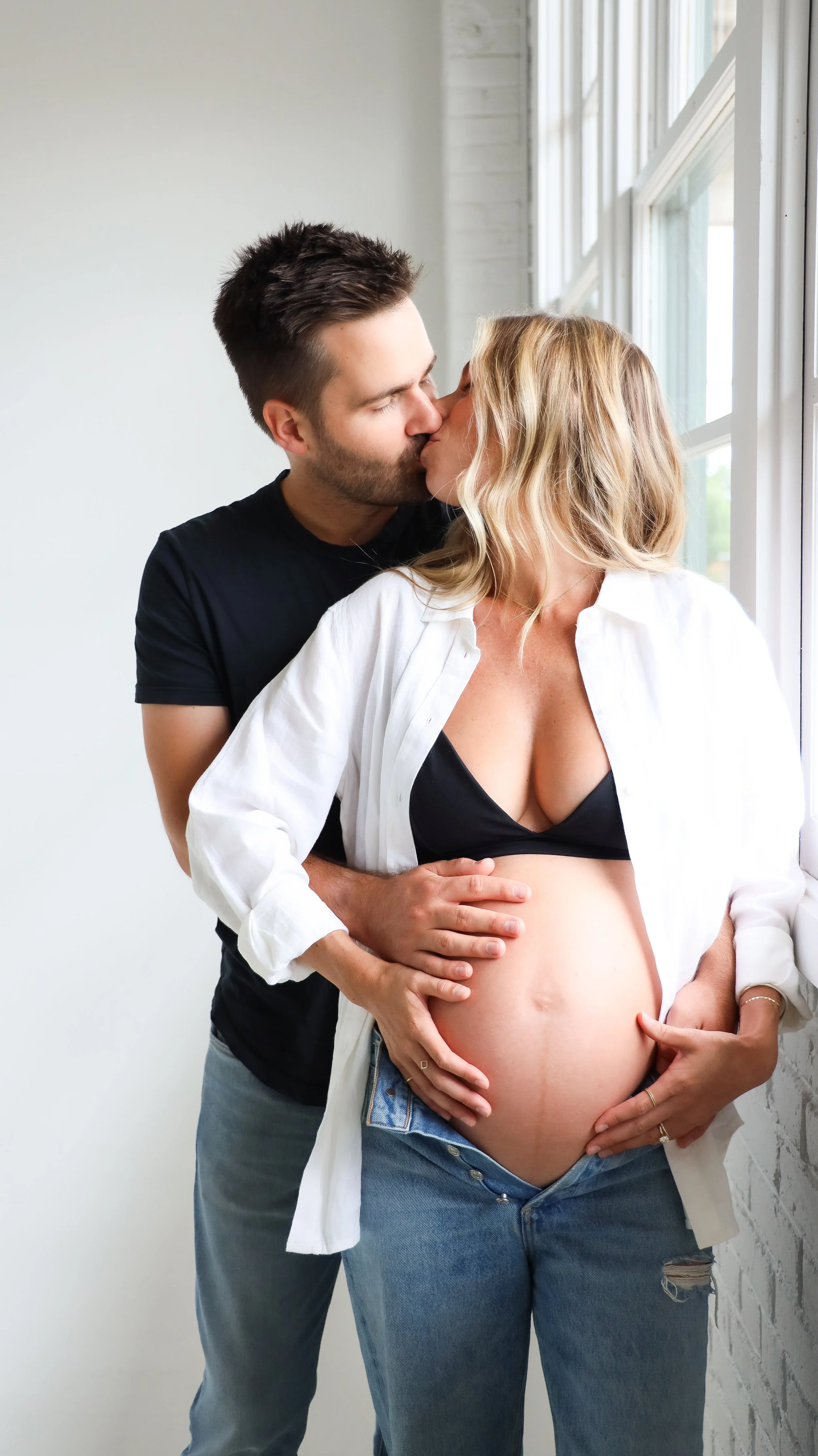 Celebrate the Middleton's journey into parenthood with stunning maternity photography at Realm Studio in Denver, CO, expertly captured by Nicole Schmiedl.