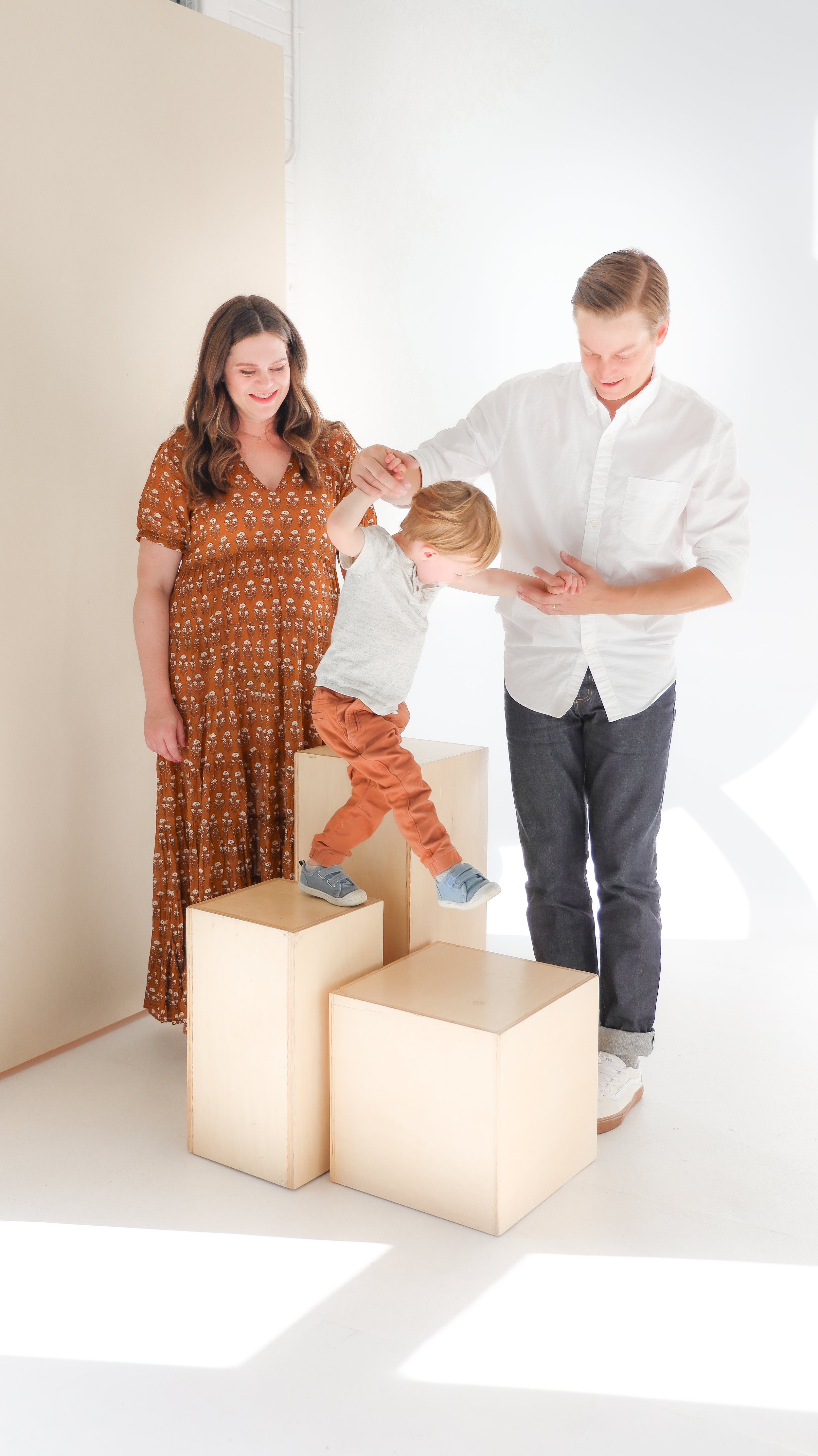 Youngblade family, captured in beautiful maternity photos, eagerly expanding to four. Precious moments in family and maternity photography."