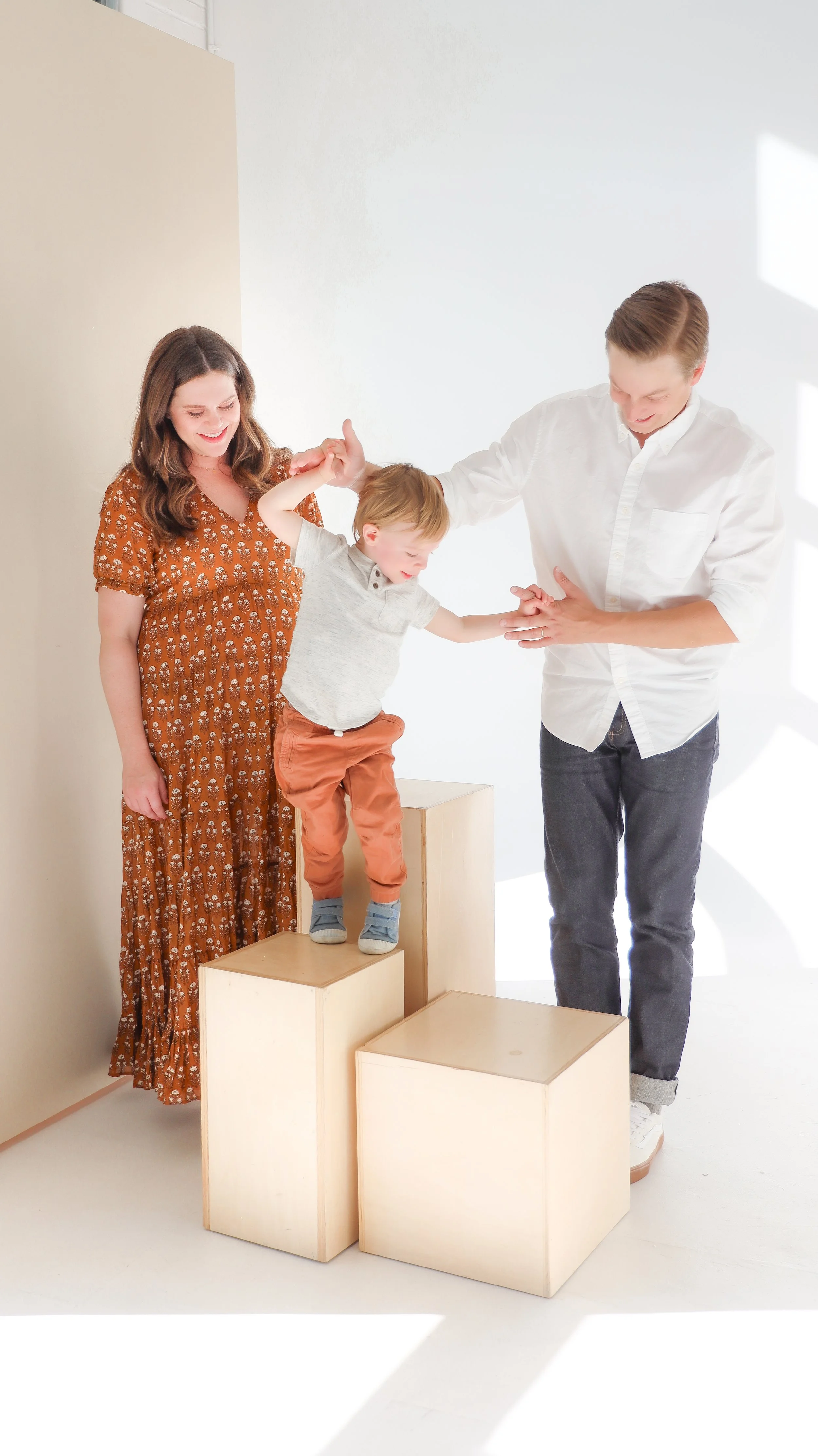 Youngblade family, captured in beautiful maternity photos, eagerly expanding to four. Precious moments in family and maternity photography."