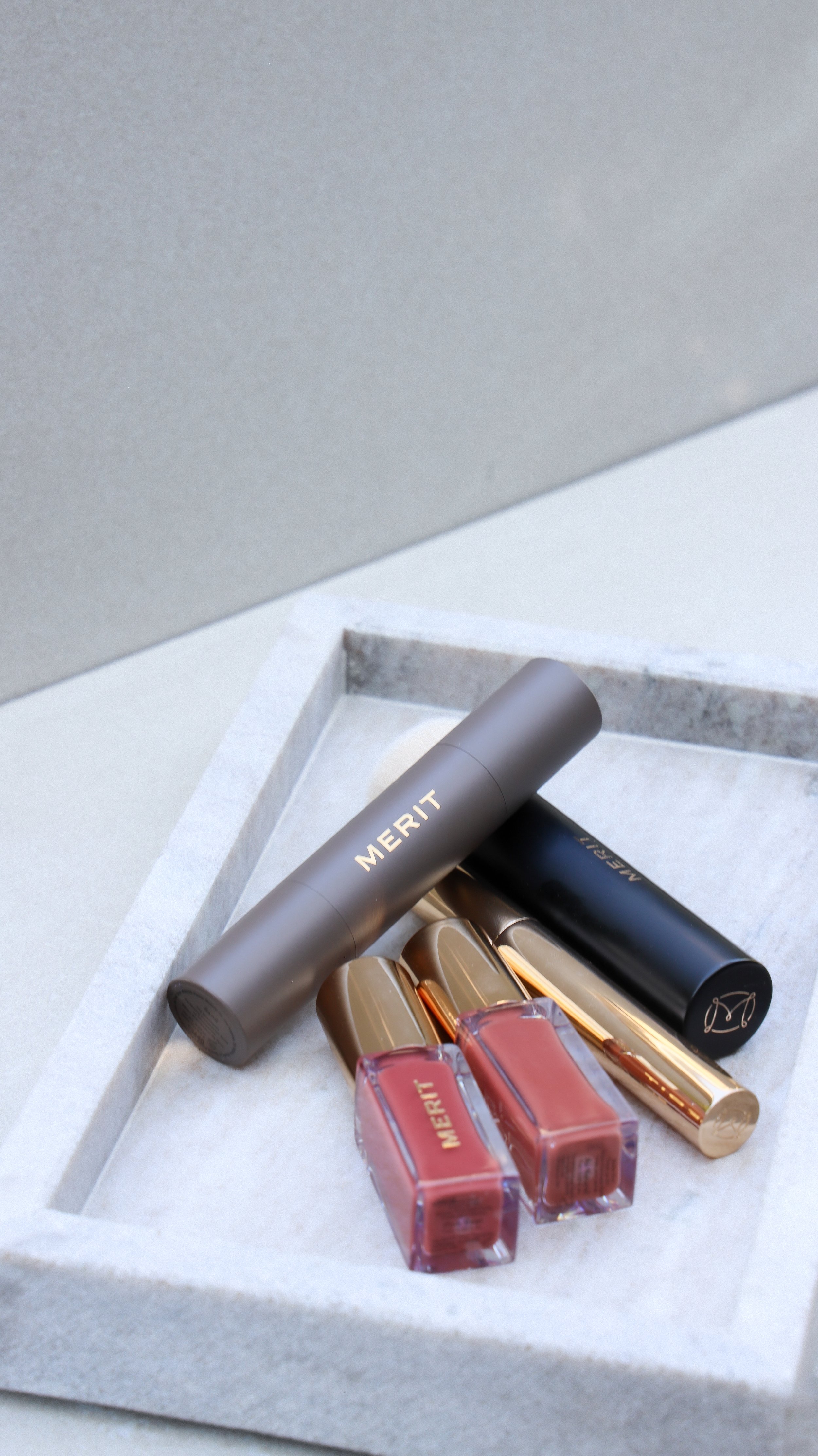 Merit Beauty lip stain, brow gel, concealer and blending brush by Nicole Schmiedl