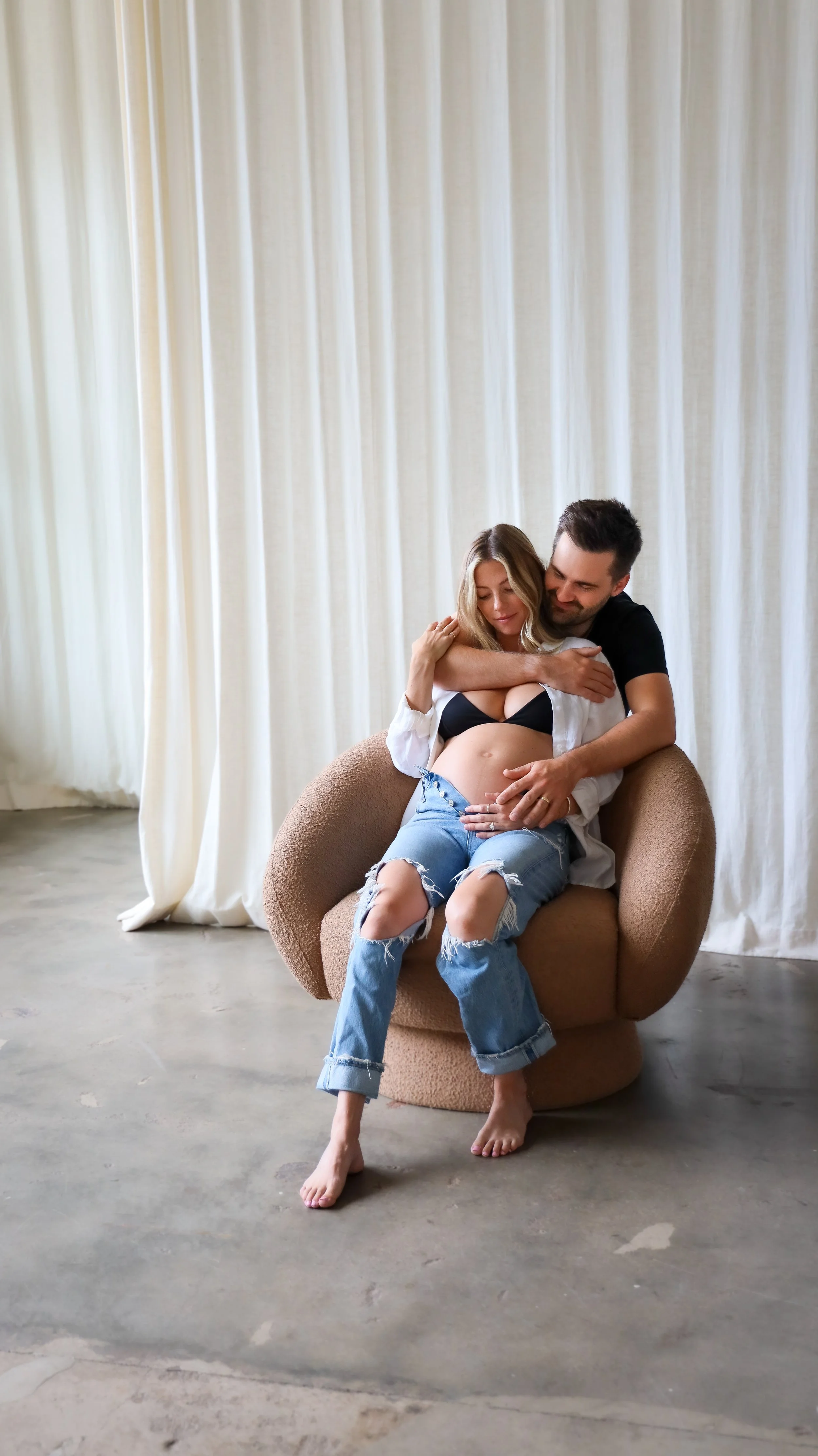 Celebrate the Middleton's journey into parenthood with stunning maternity photography at Realm Studio in Denver, CO, expertly captured by Nicole Schmiedl.