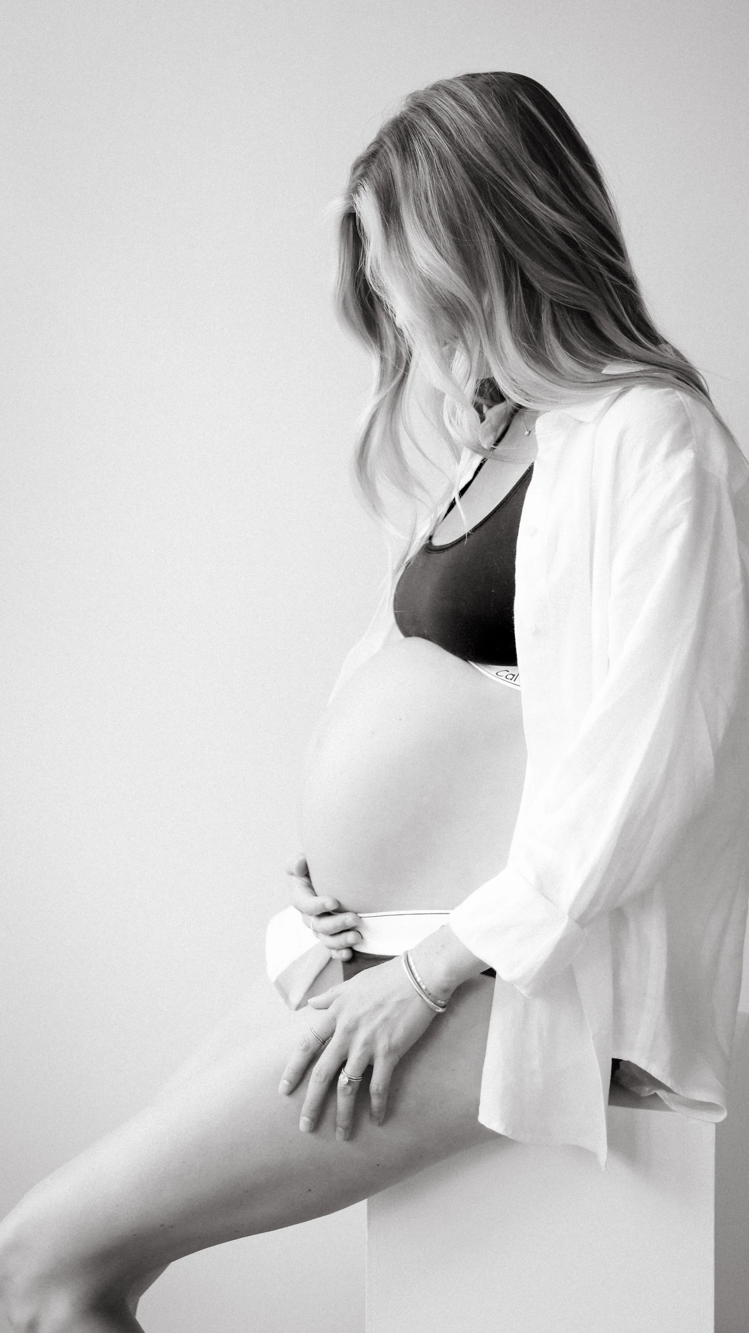 Celebrate the Middleton's journey into parenthood with stunning maternity photography at Realm Studio in Denver, CO, expertly captured by Nicole Schmiedl.