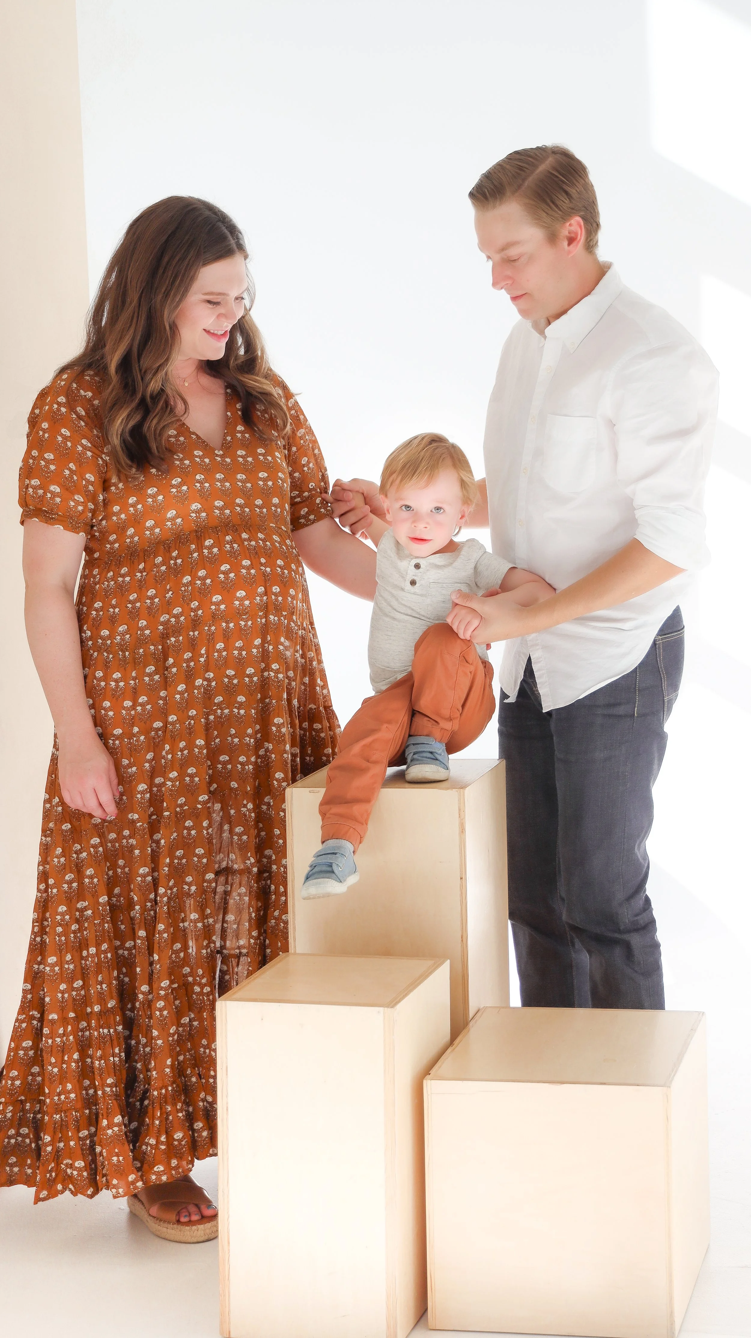 Youngblade family, captured in beautiful maternity photos, eagerly expanding to four. Precious moments in family and maternity photography."