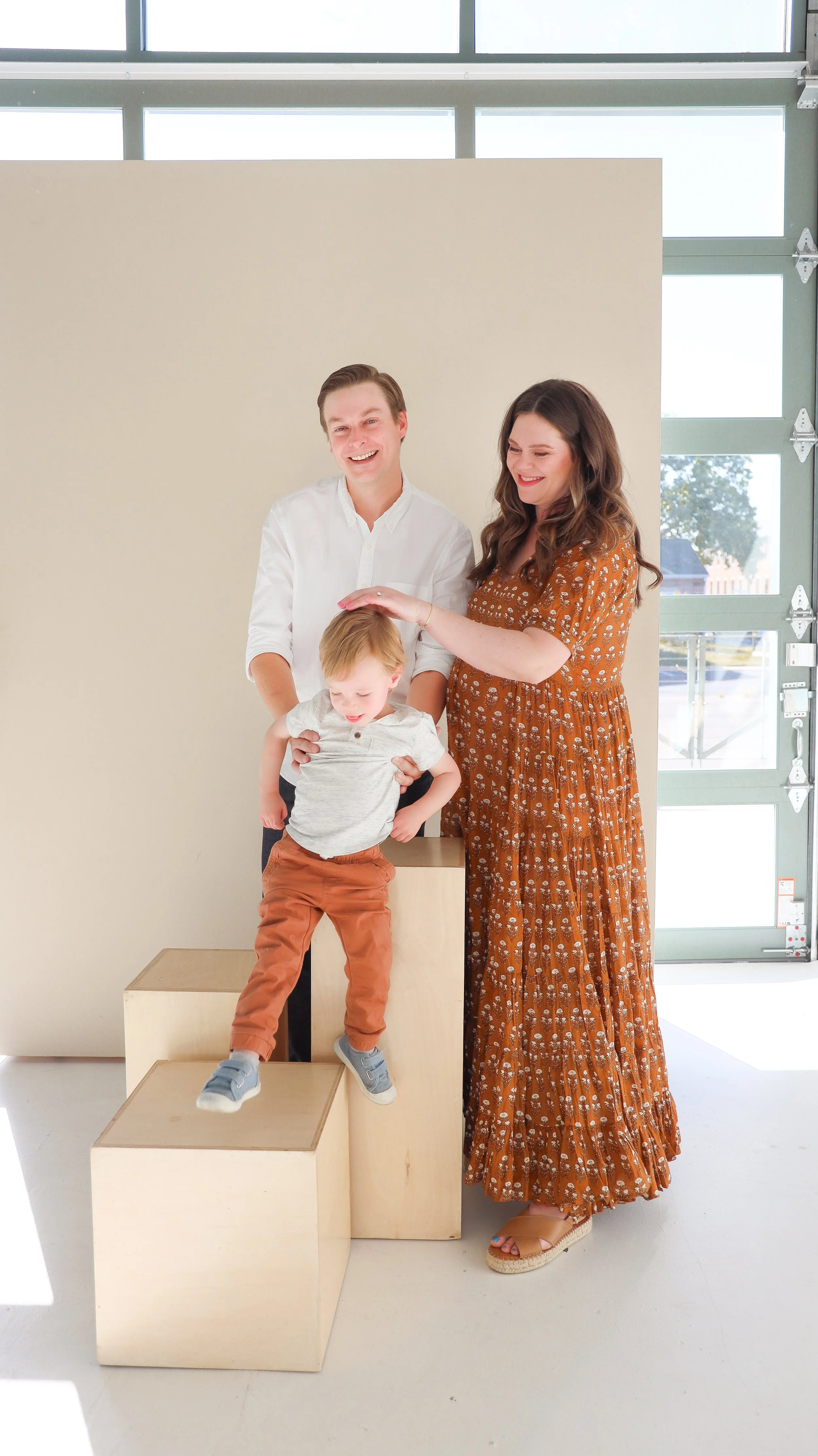 Youngblade family, captured in beautiful maternity photos, eagerly expanding to four. Precious moments in family and maternity photography."