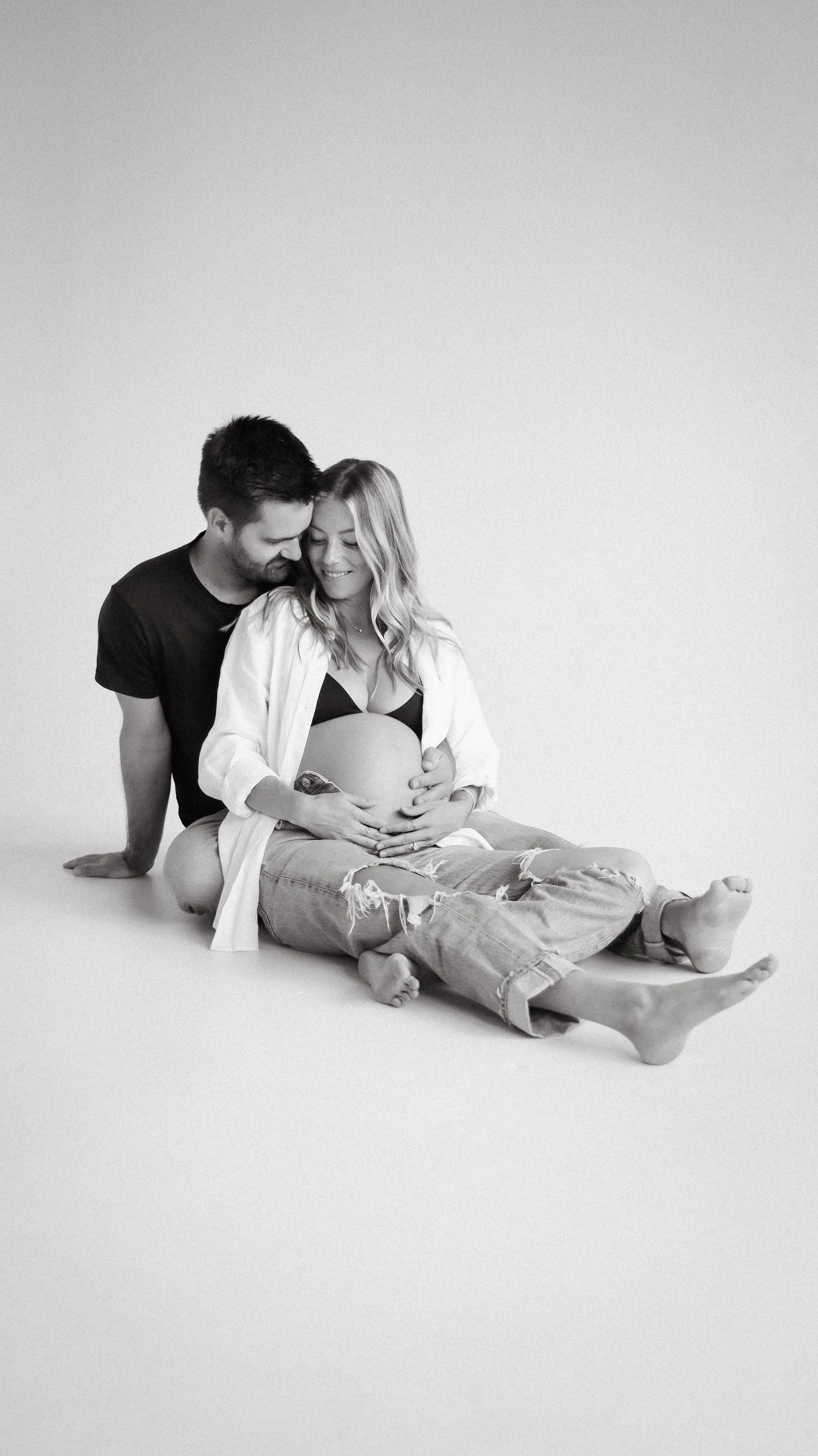 Celebrate the Middleton's journey into parenthood with stunning maternity photography at Realm Studio in Denver, CO, expertly captured by Nicole Schmiedl.