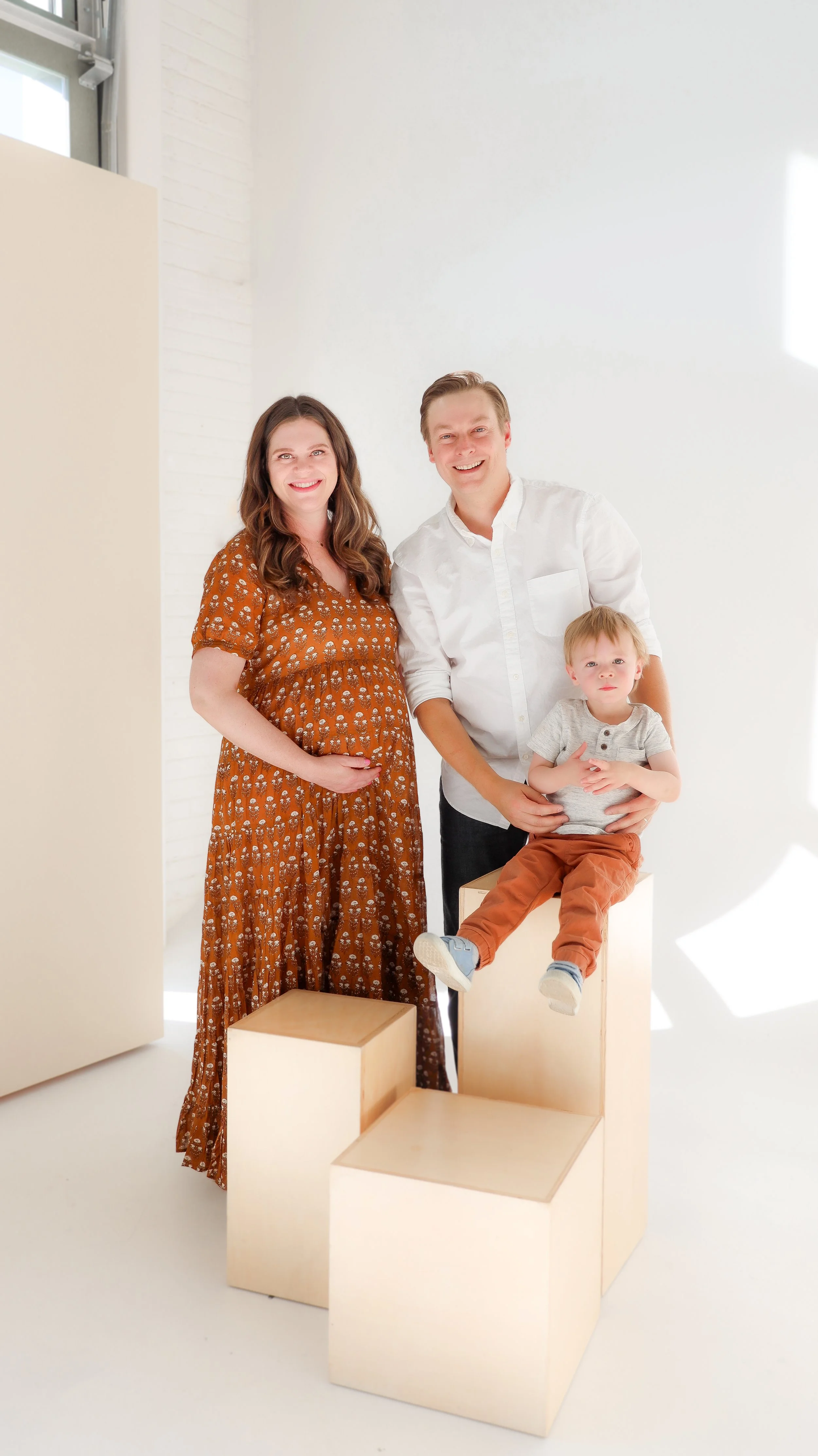 Youngblade family, captured in beautiful maternity photos, eagerly expanding to four. Precious moments in family and maternity photography."