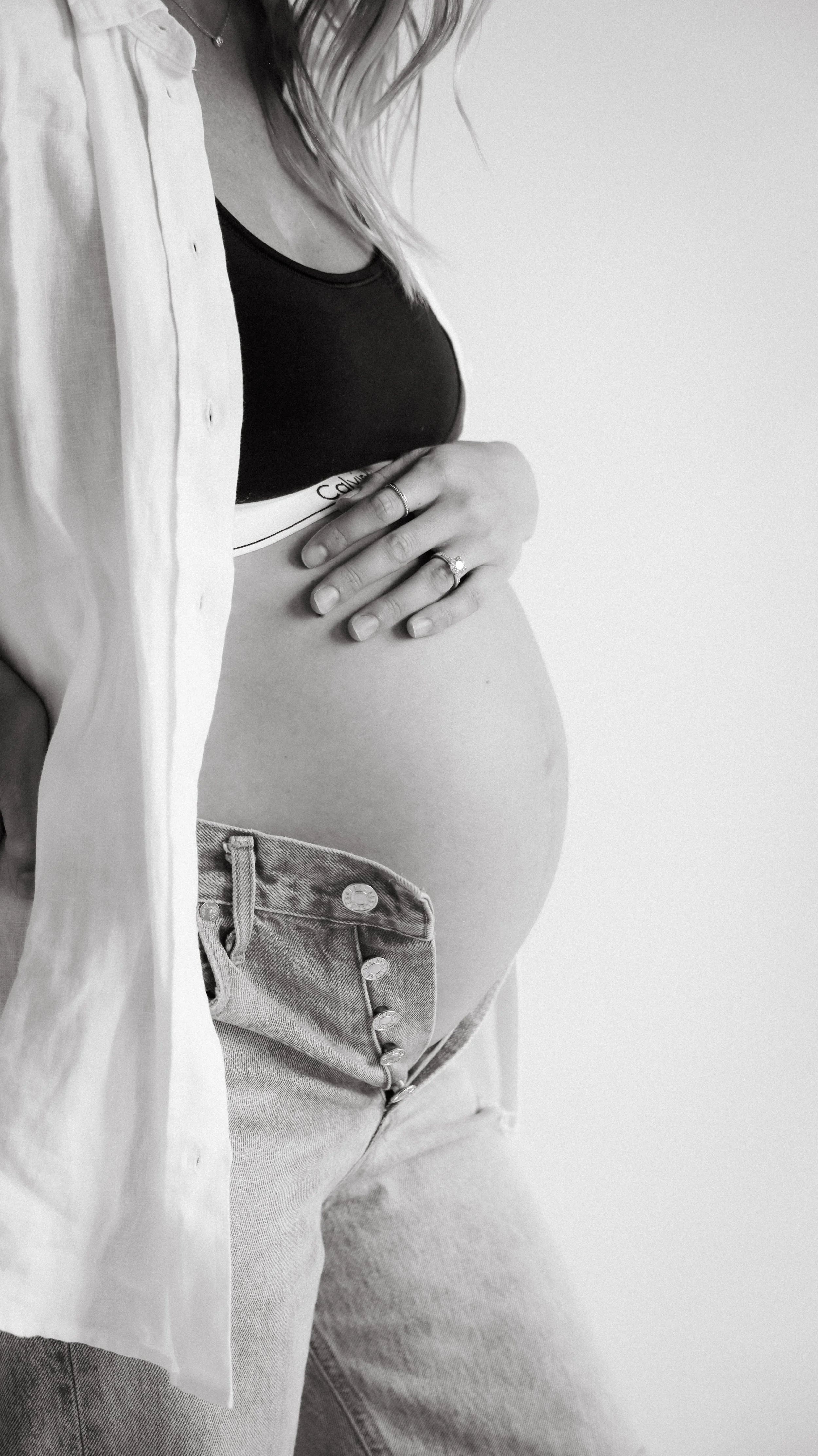 Celebrate the Middleton's journey into parenthood with stunning maternity photography at Realm Studio in Denver, CO, expertly captured by Nicole Schmiedl.