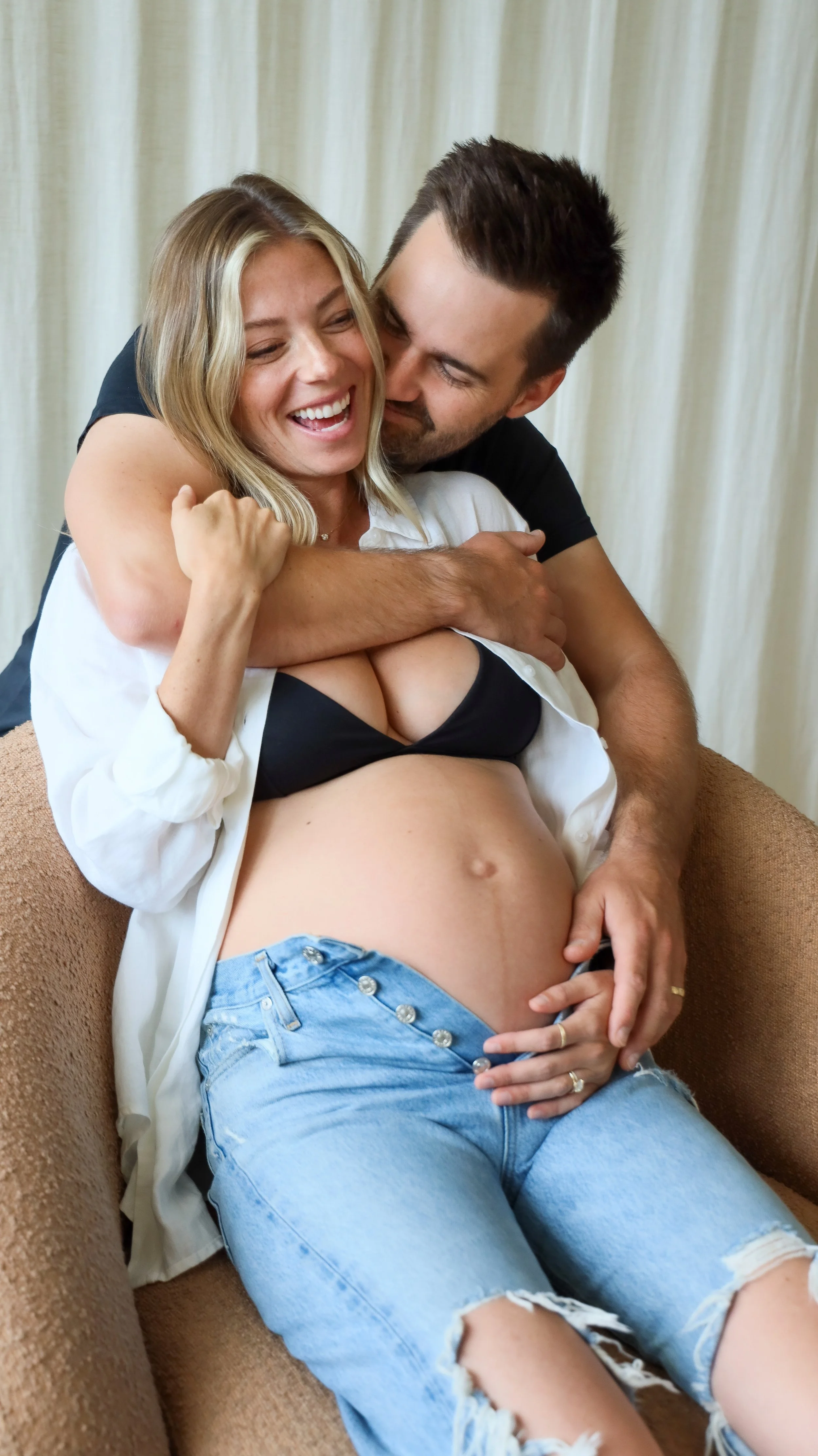 Celebrate the Middleton's journey into parenthood with stunning maternity photography at Realm Studio in Denver, CO, expertly captured by Nicole Schmiedl.