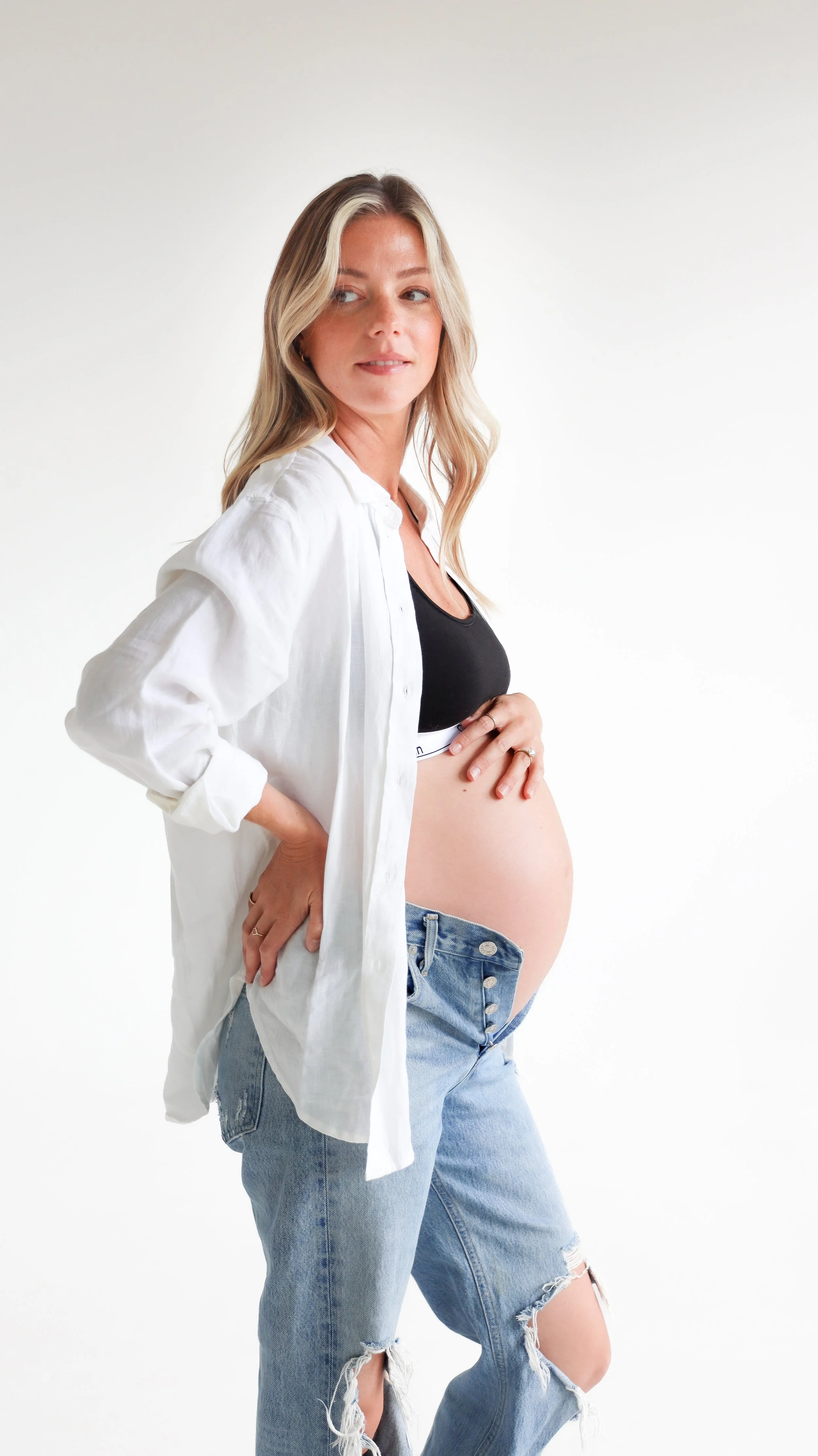 Celebrate the Middleton's journey into parenthood with stunning maternity photography at Realm Studio in Denver, CO, expertly captured by Nicole Schmiedl.