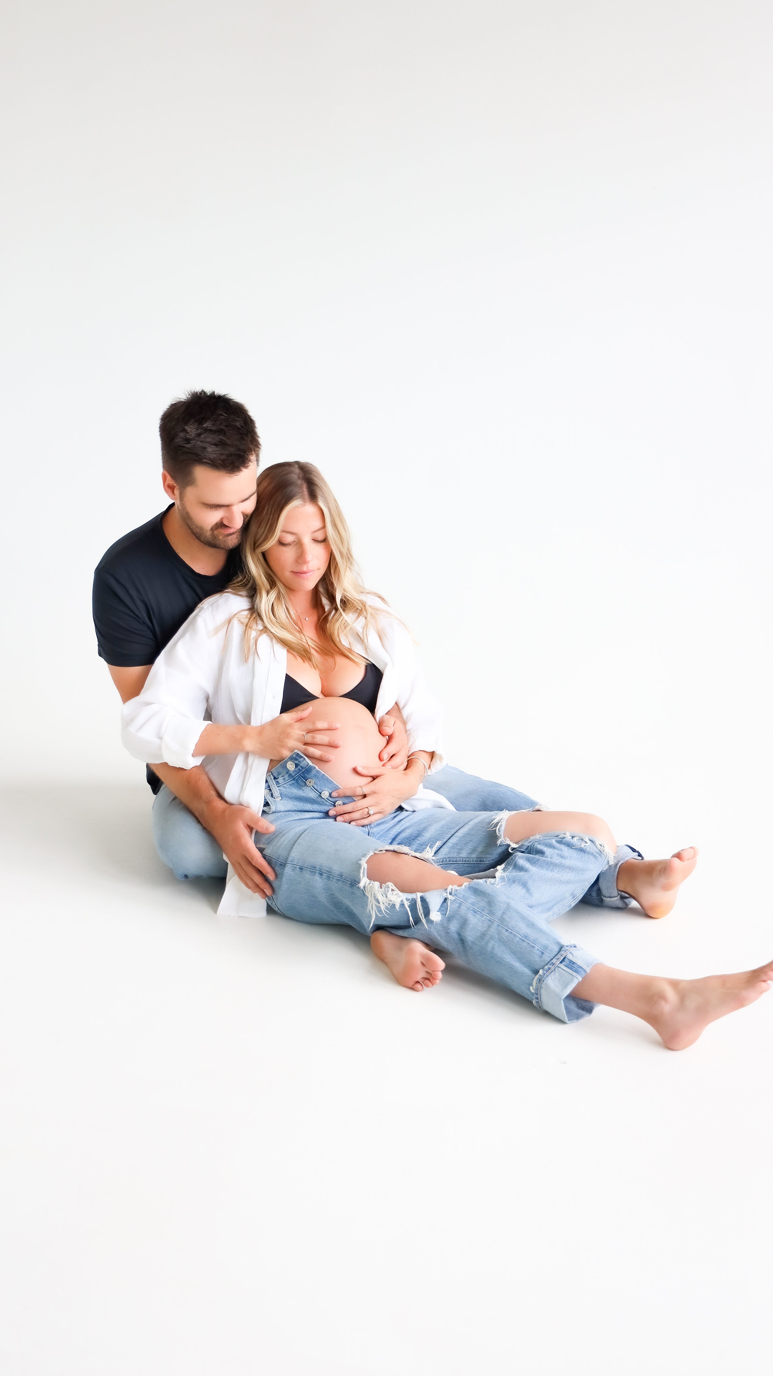Celebrate the Middleton's journey into parenthood with stunning maternity photography at Realm Studio in Denver, CO, expertly captured by Nicole Schmiedl.