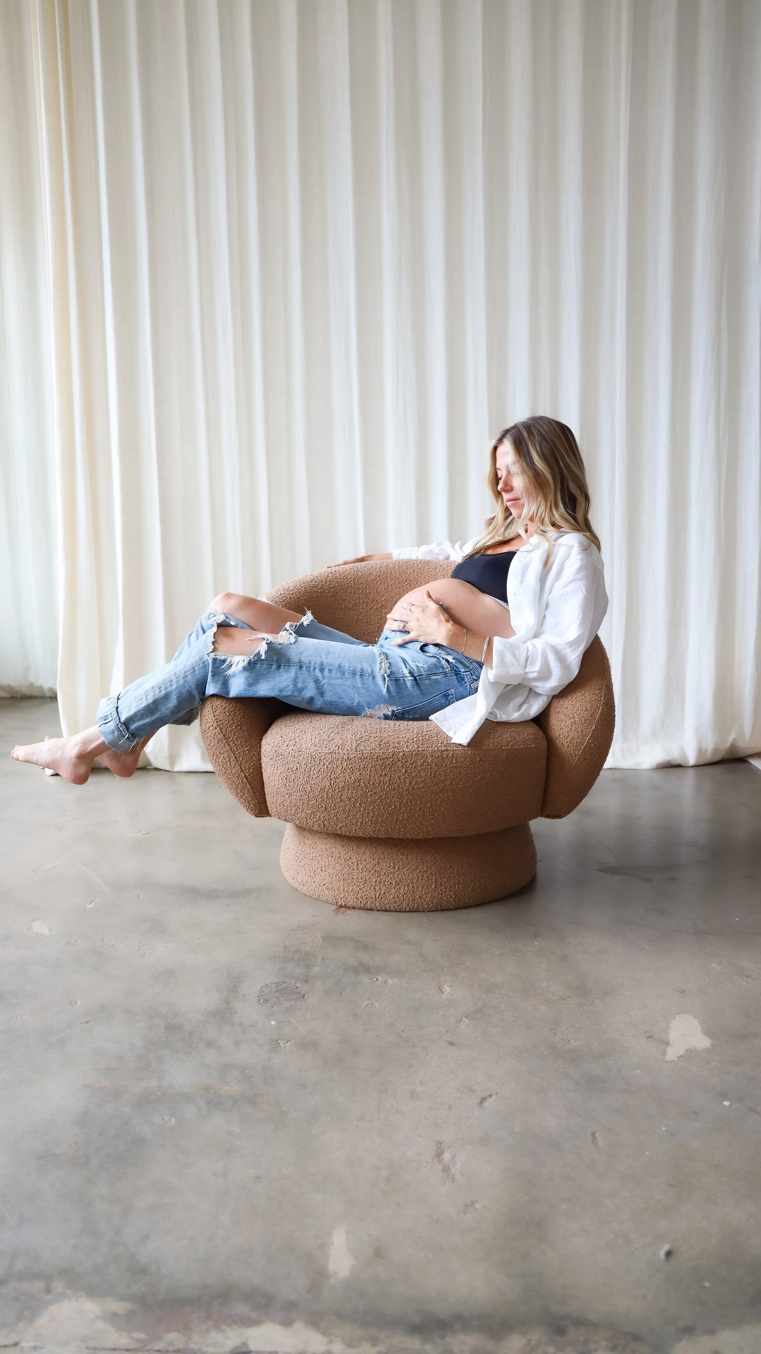 Celebrate the Middleton's journey into parenthood with stunning maternity photography at Realm Studio in Denver, CO, expertly captured by Nicole Schmiedl.