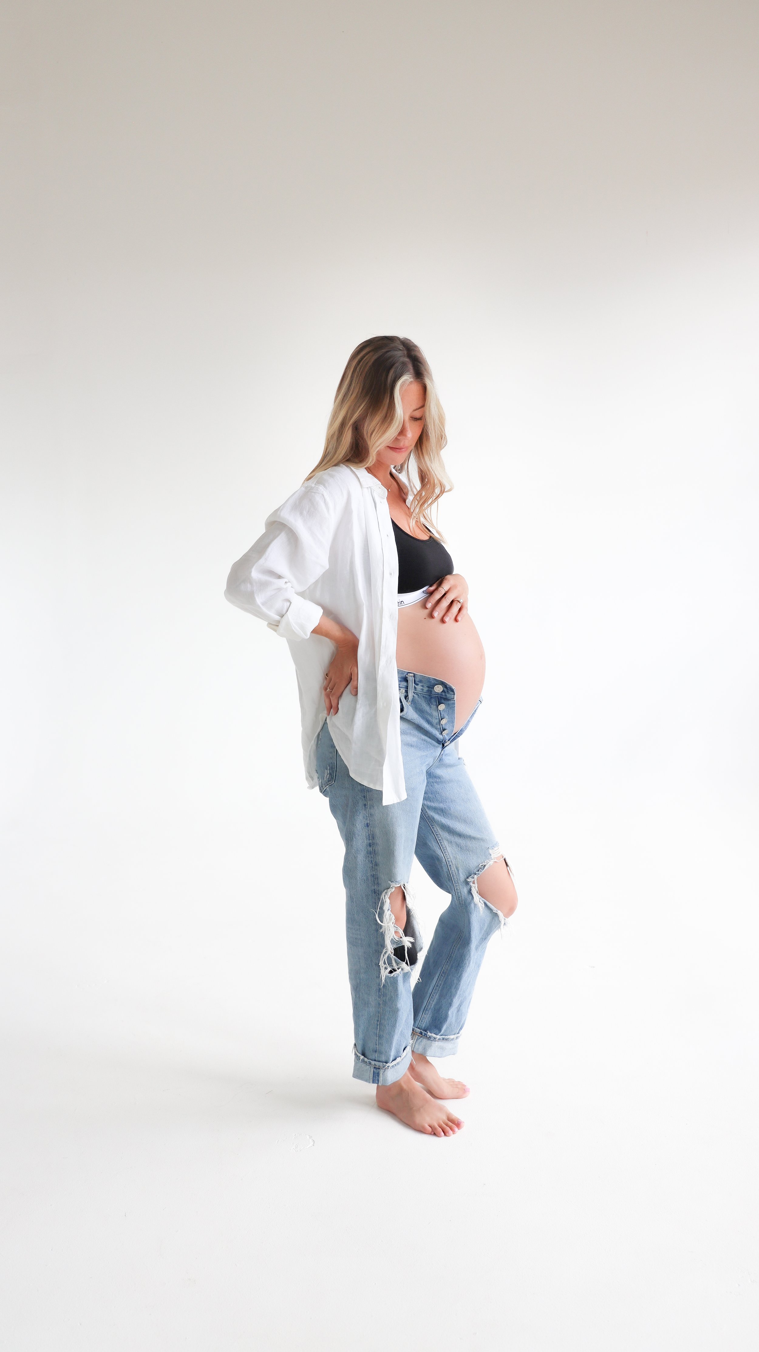 Celebrate the Middleton's journey into parenthood with stunning maternity photography at Realm Studio in Denver, CO, expertly captured by Nicole Schmiedl.