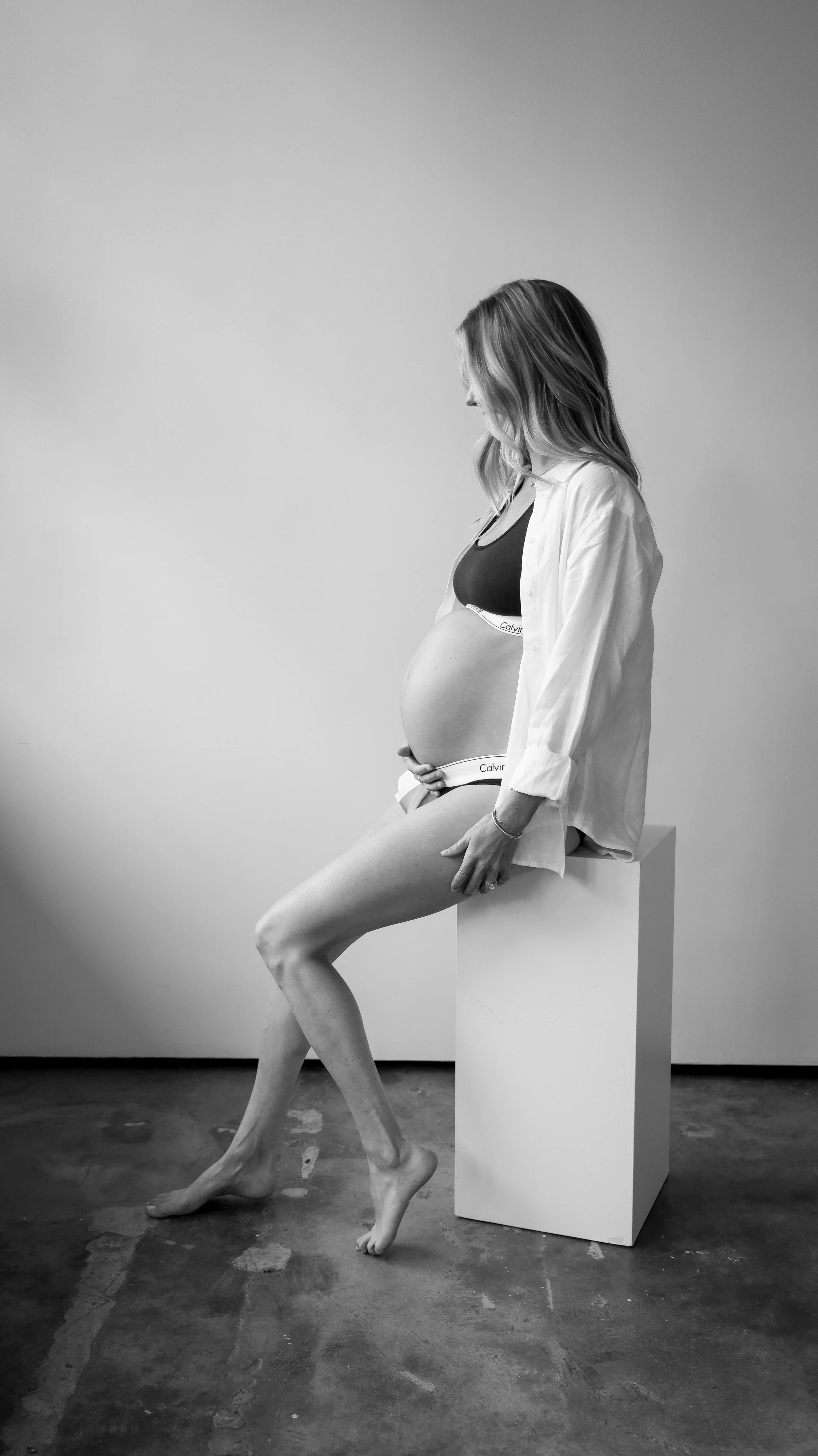 Celebrate the Middleton's journey into parenthood with stunning maternity photography at Realm Studio in Denver, CO, expertly captured by Nicole Schmiedl.