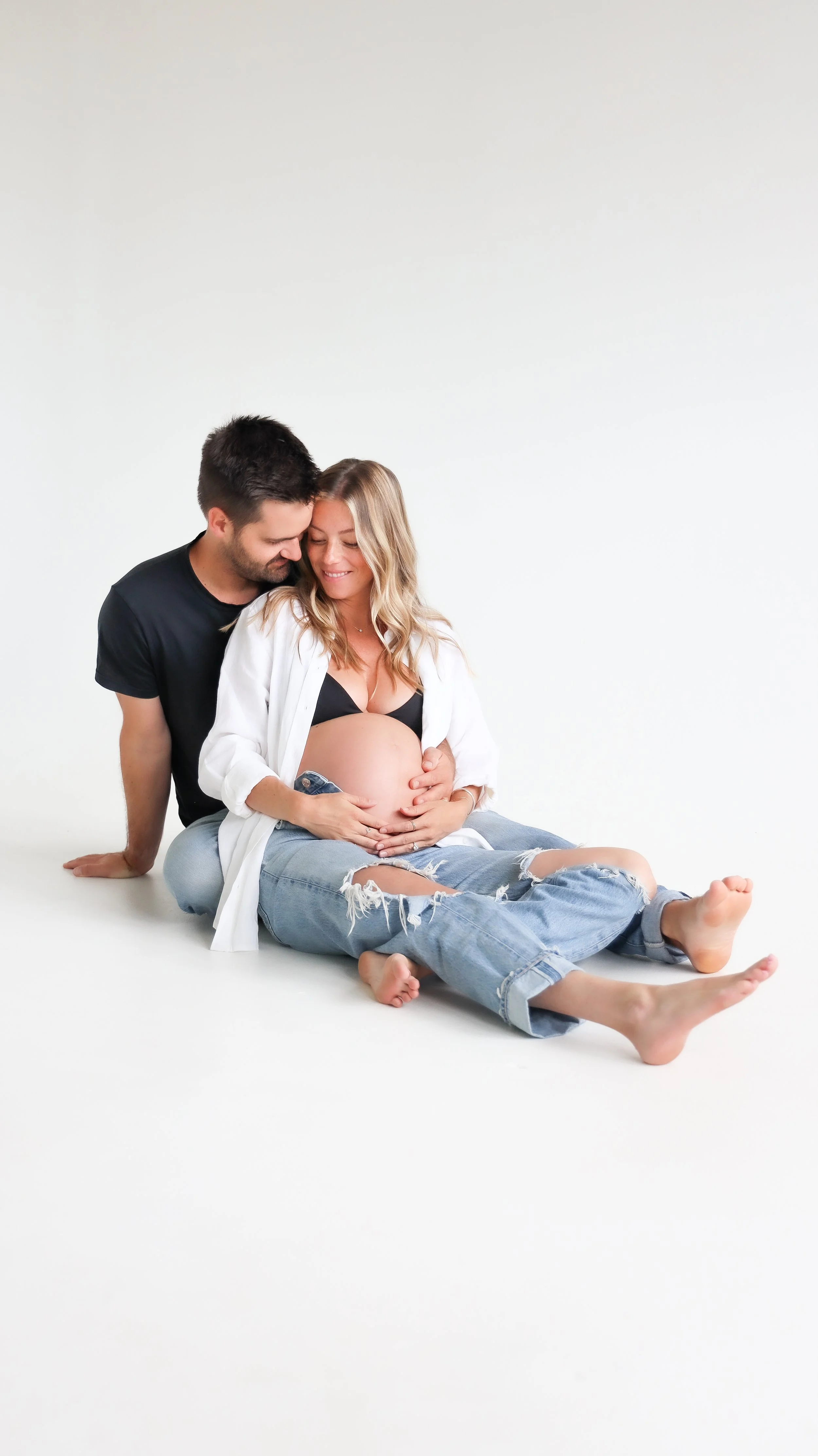 Celebrate the Middleton's journey into parenthood with stunning maternity photography at Realm Studio in Denver, CO, expertly captured by Nicole Schmiedl.