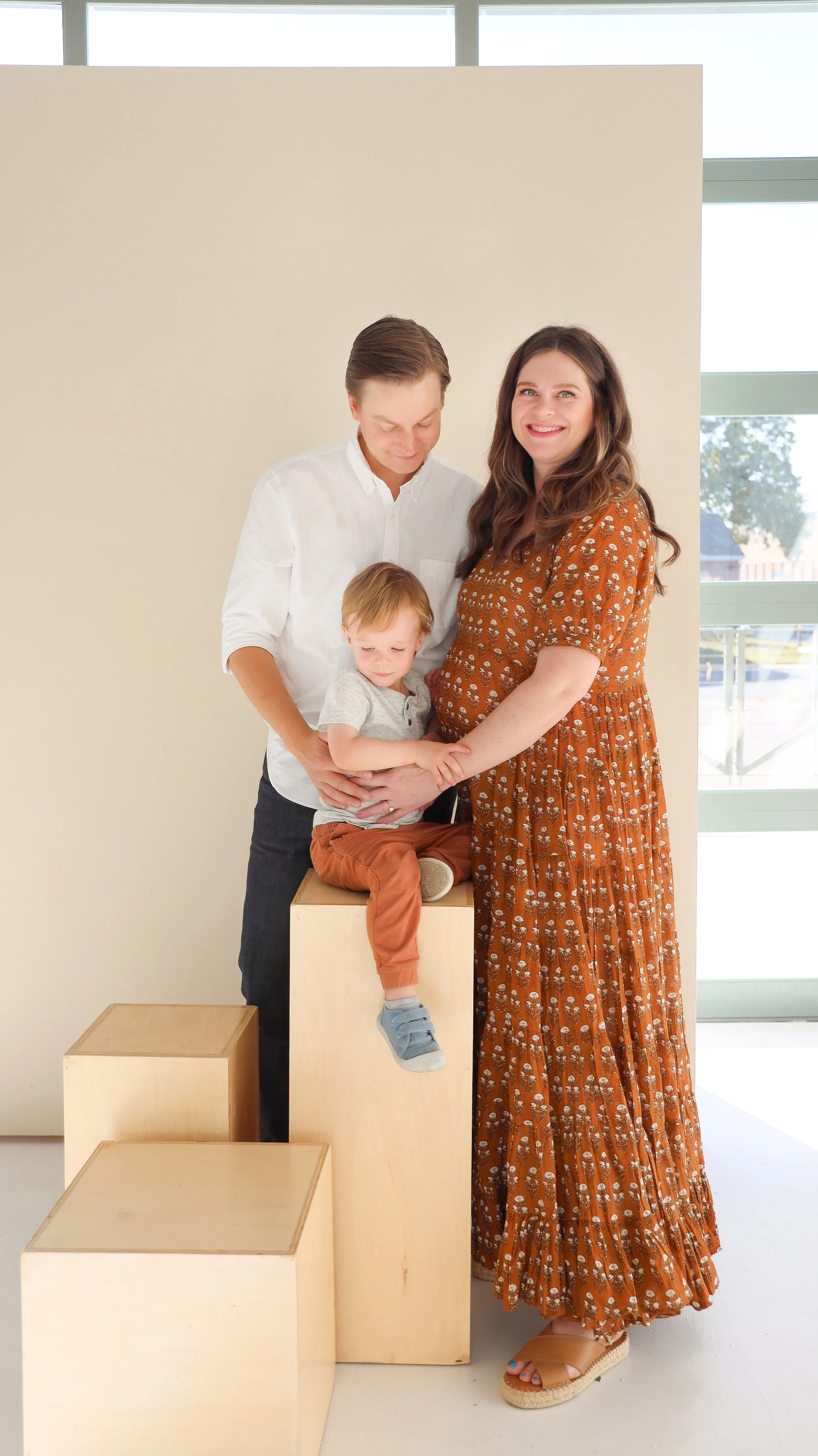 Youngblade family, captured in beautiful maternity photos, eagerly expanding to four. Precious moments in family and maternity photography."