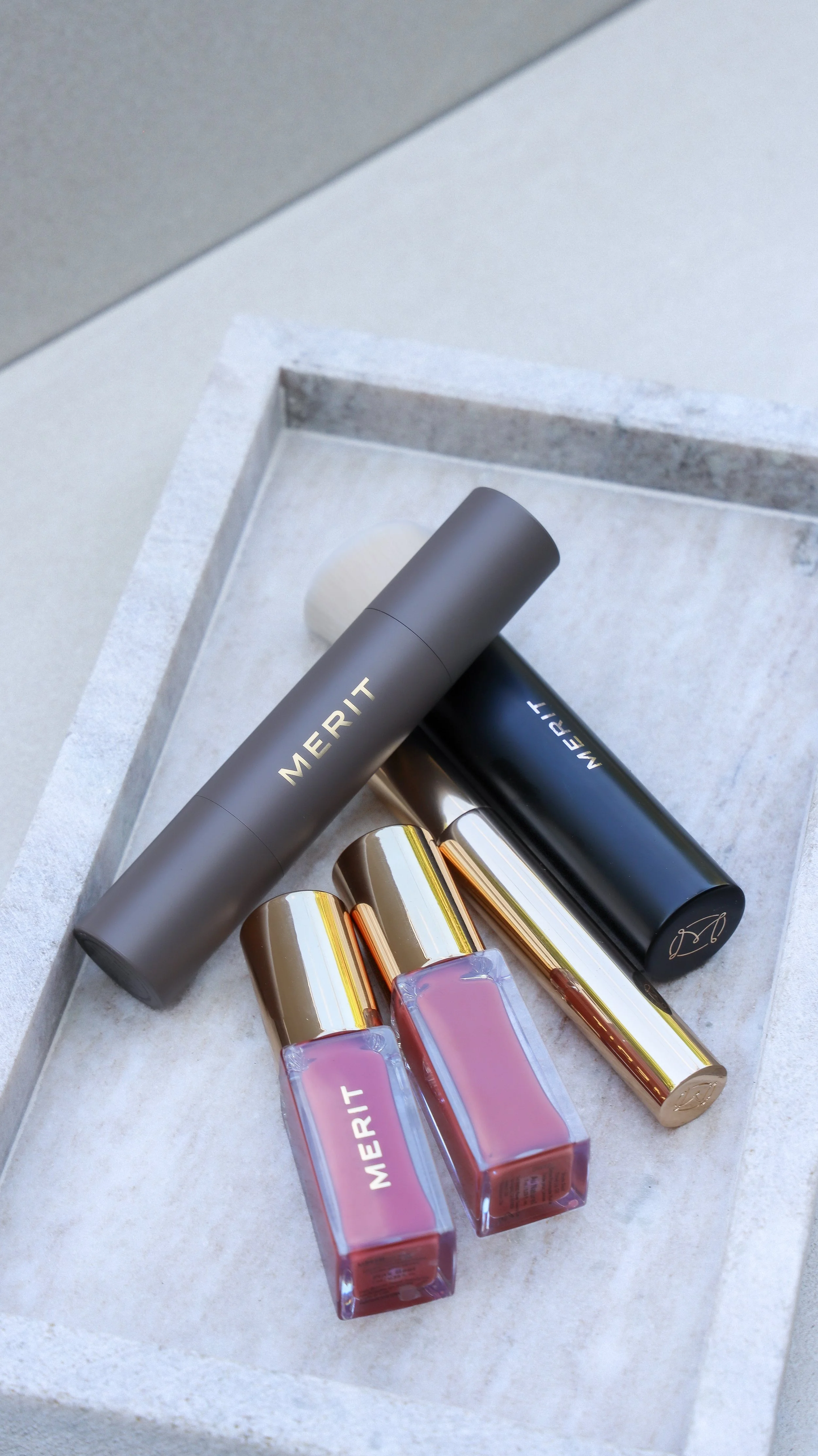 Merit Beauty lip stain, brow gel, concealer and blending brush by Nicole Schmiedl
