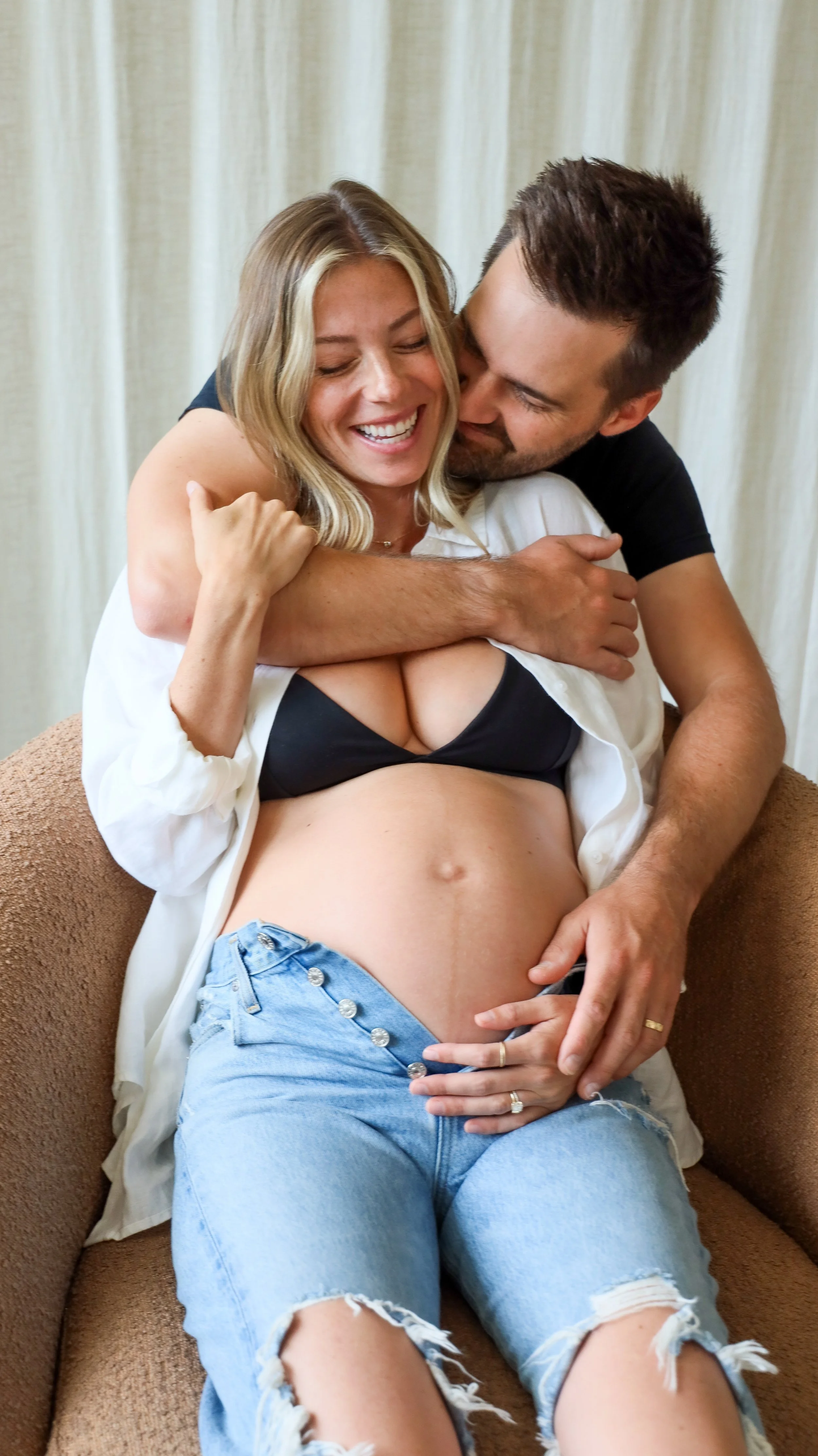 Celebrate the Middleton's journey into parenthood with stunning maternity photography at Realm Studio in Denver, CO, expertly captured by Nicole Schmiedl.
