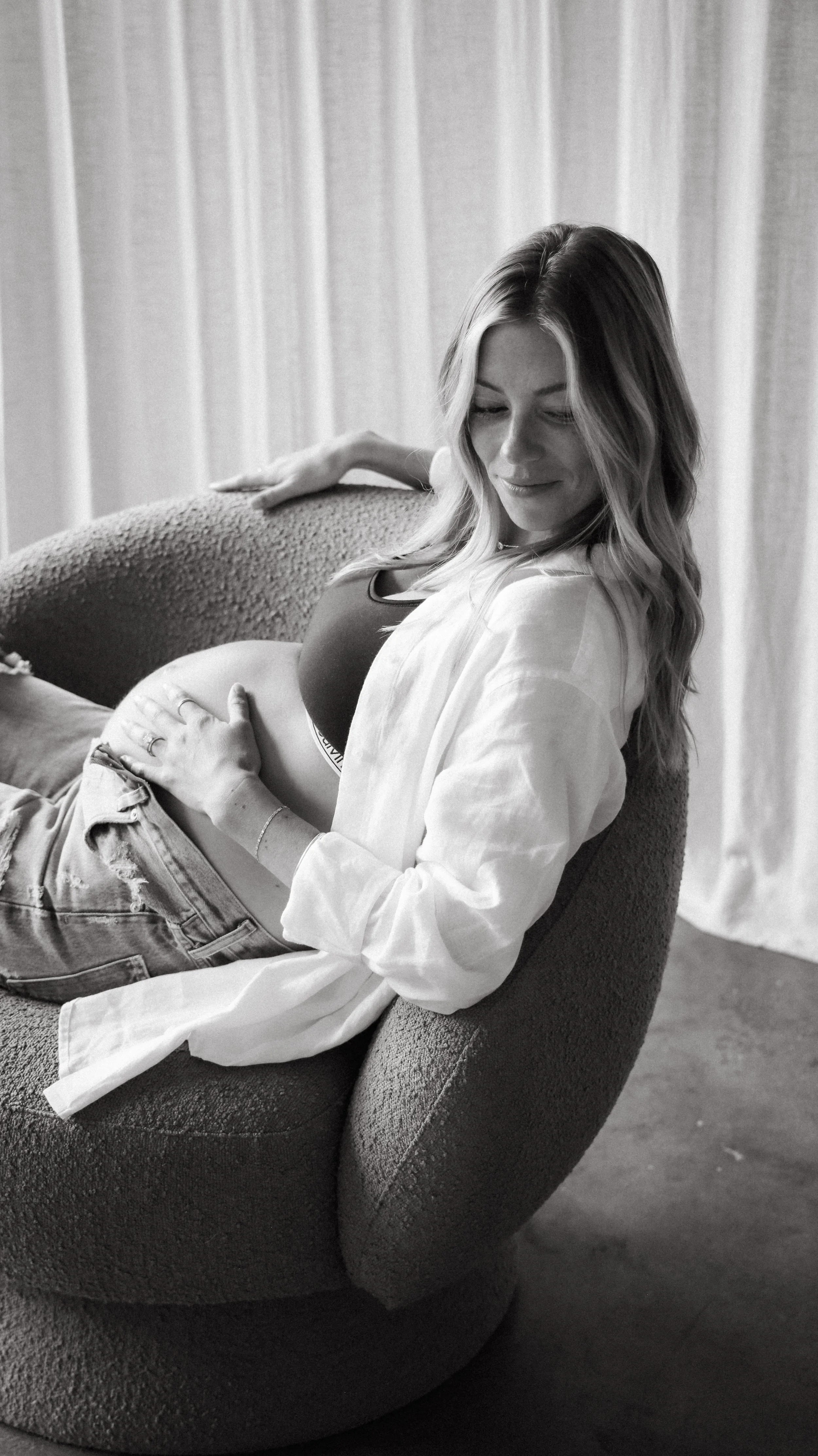 Celebrate the Middleton's journey into parenthood with stunning maternity photography at Realm Studio in Denver, CO, expertly captured by Nicole Schmiedl.