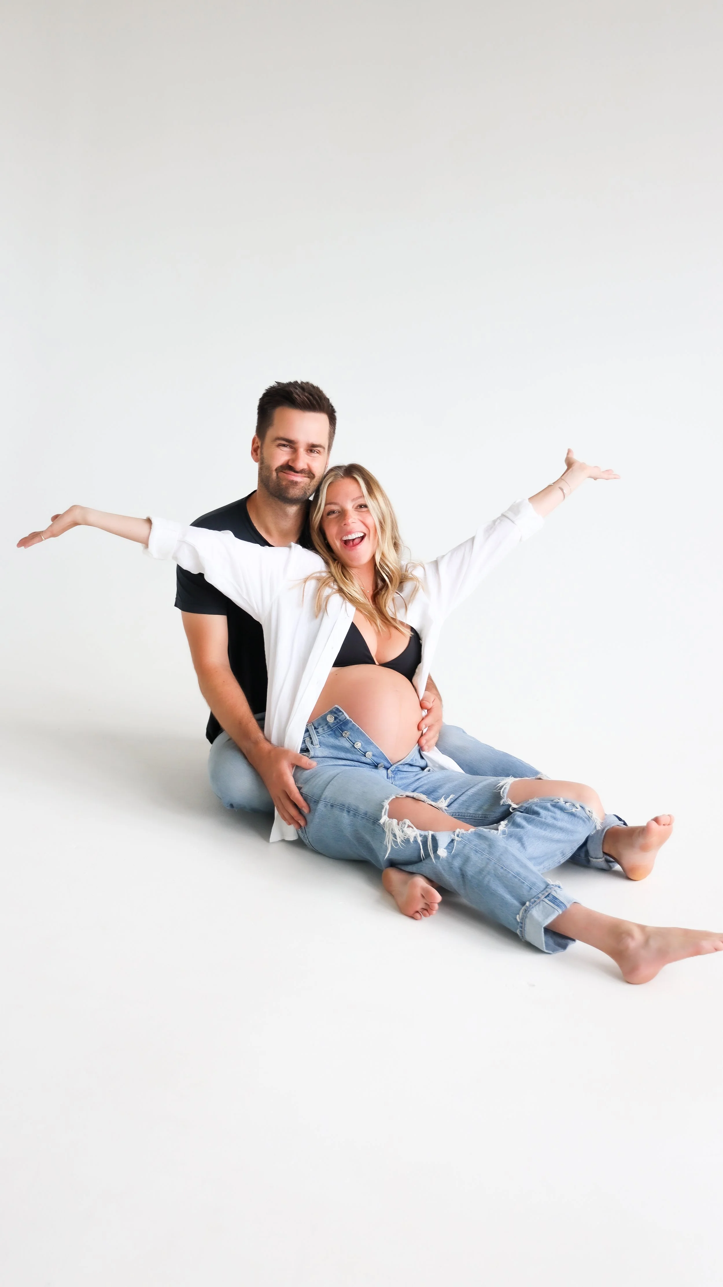 Celebrate the Middleton's journey into parenthood with stunning maternity photography at Realm Studio in Denver, CO, expertly captured by Nicole Schmiedl.