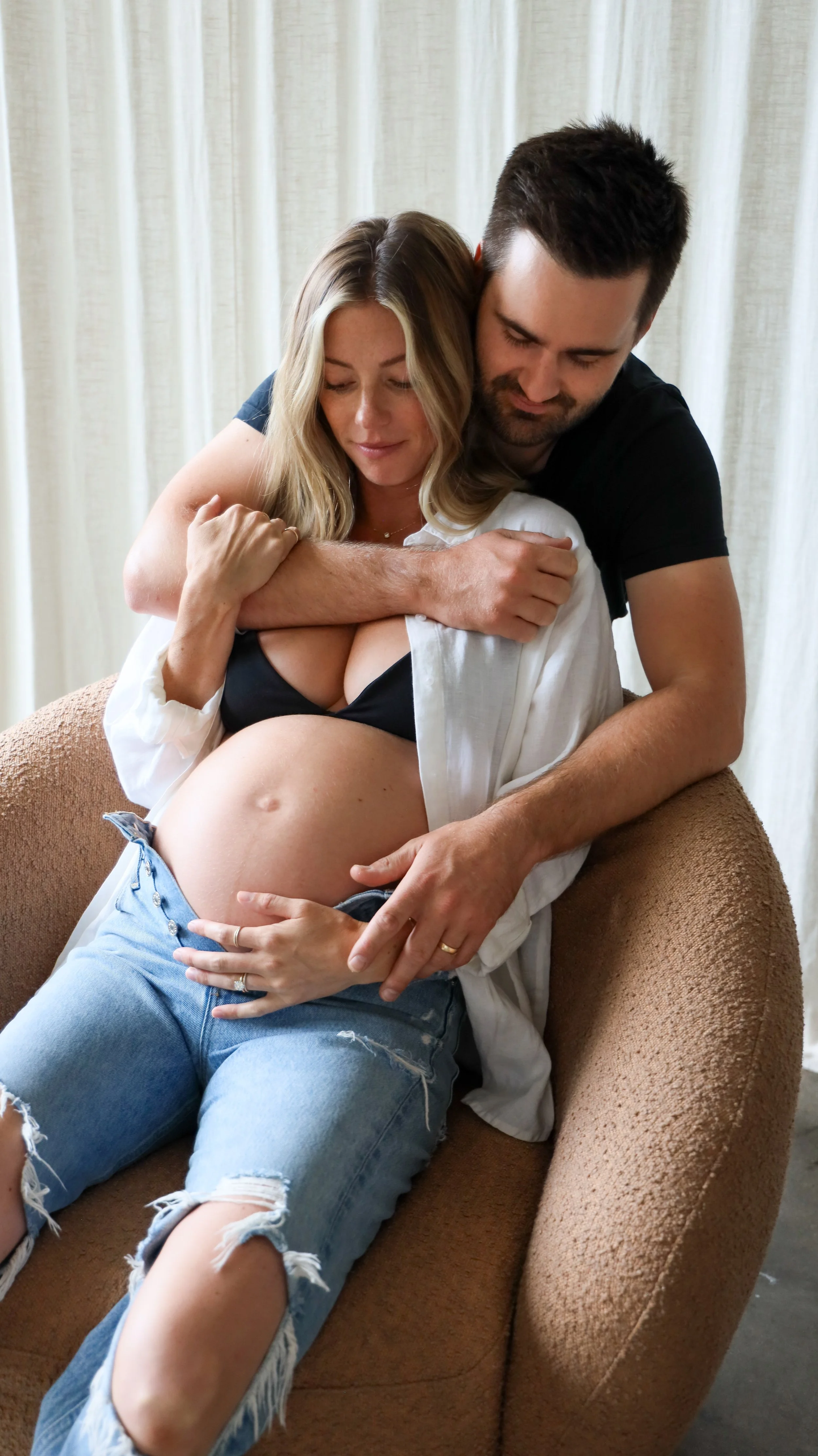 Celebrate the Middleton's journey into parenthood with stunning maternity photography at Realm Studio in Denver, CO, expertly captured by Nicole Schmiedl.