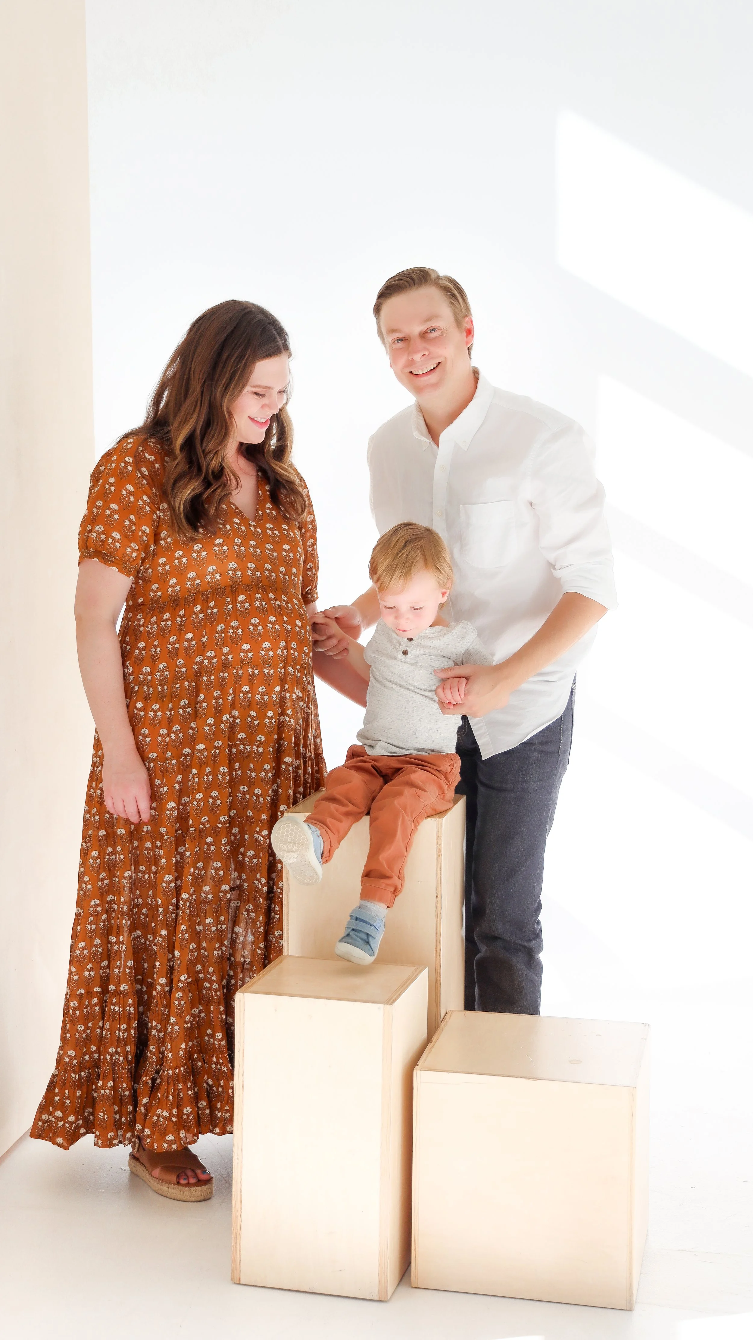 Youngblade family, captured in beautiful maternity photos, eagerly expanding to four. Precious moments in family and maternity photography."