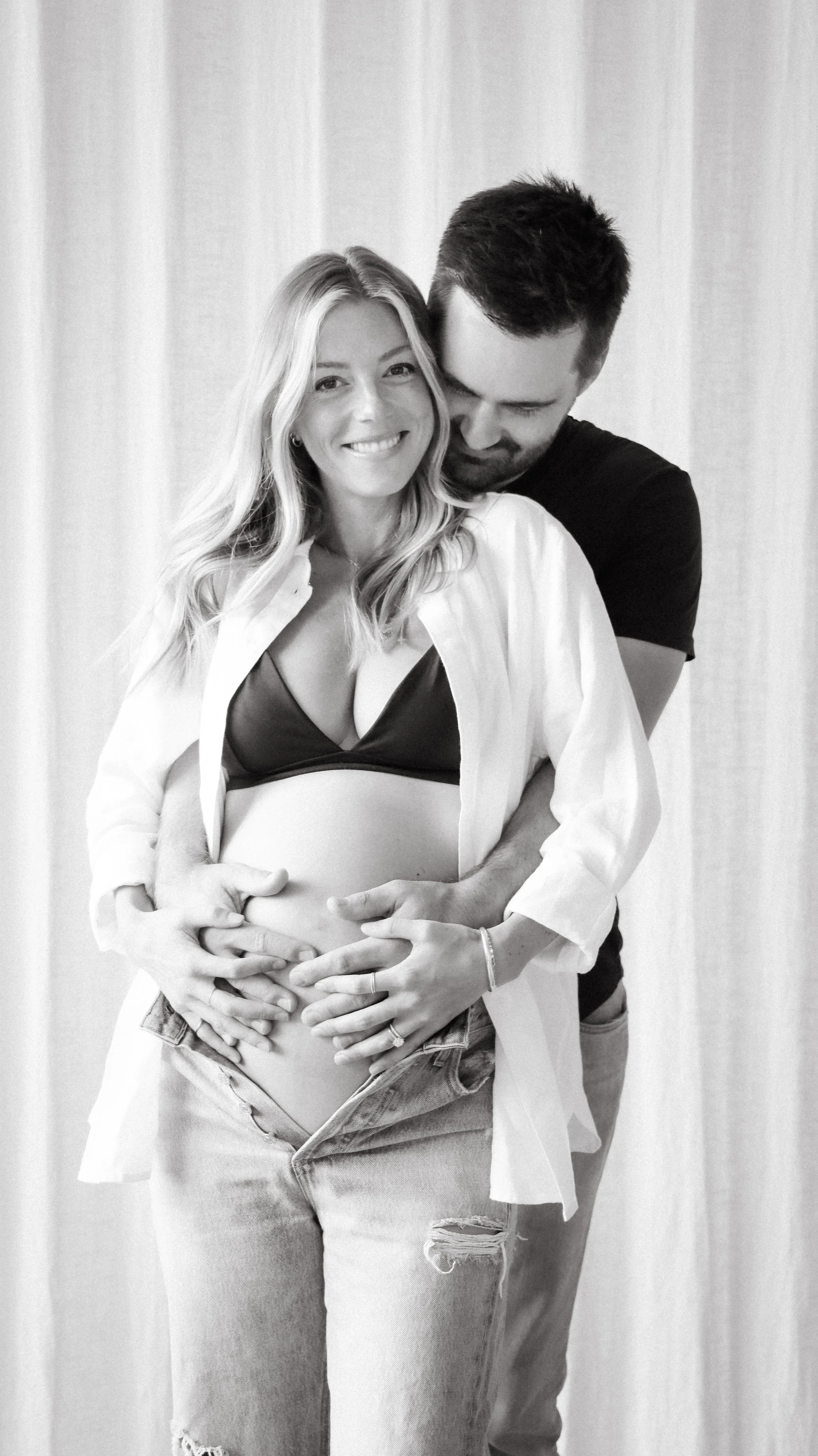 Celebrate the Middleton's journey into parenthood with stunning maternity photography at Realm Studio in Denver, CO, expertly captured by Nicole Schmiedl.