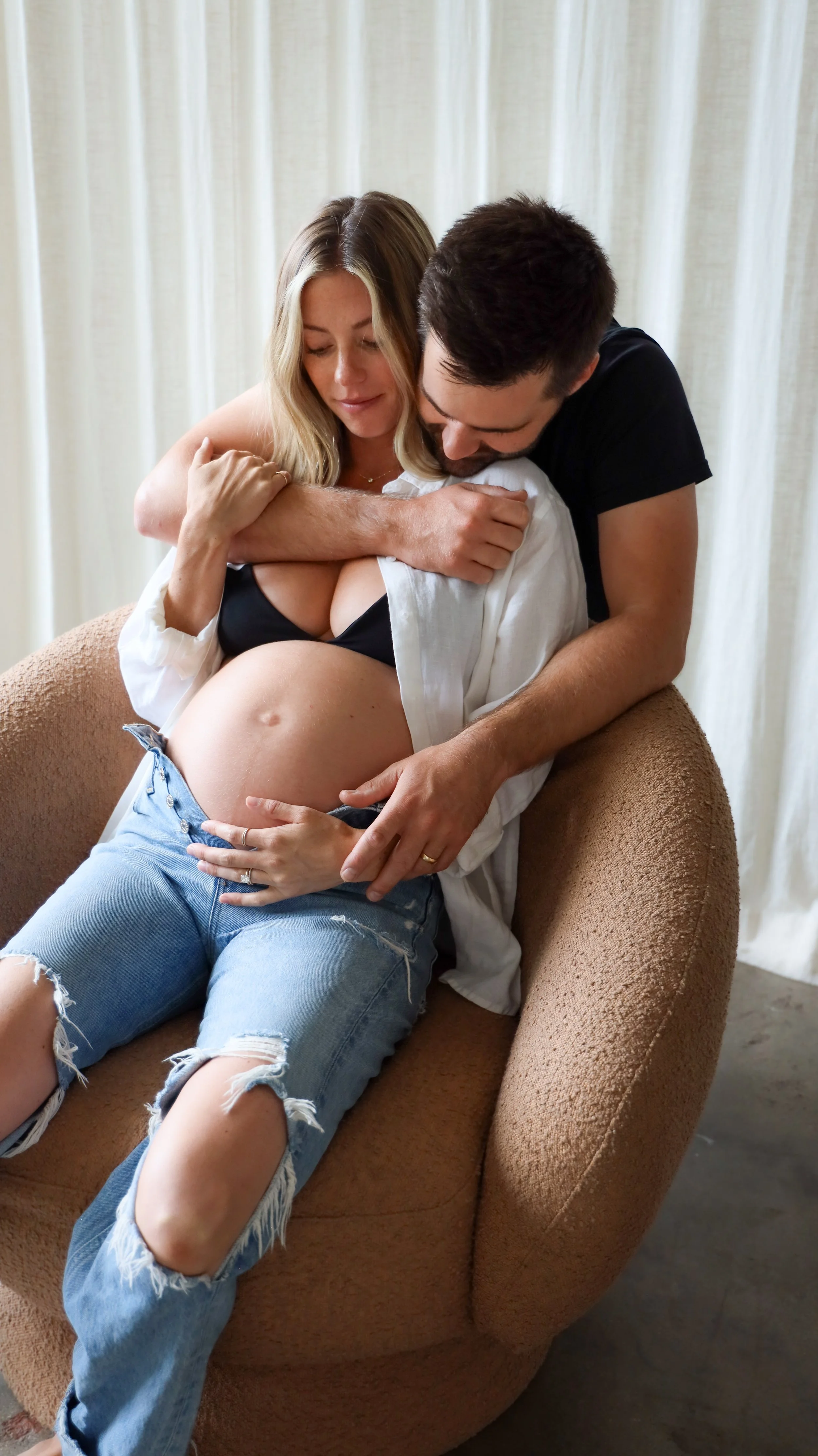Celebrate the Middleton's journey into parenthood with stunning maternity photography at Realm Studio in Denver, CO, expertly captured by Nicole Schmiedl.