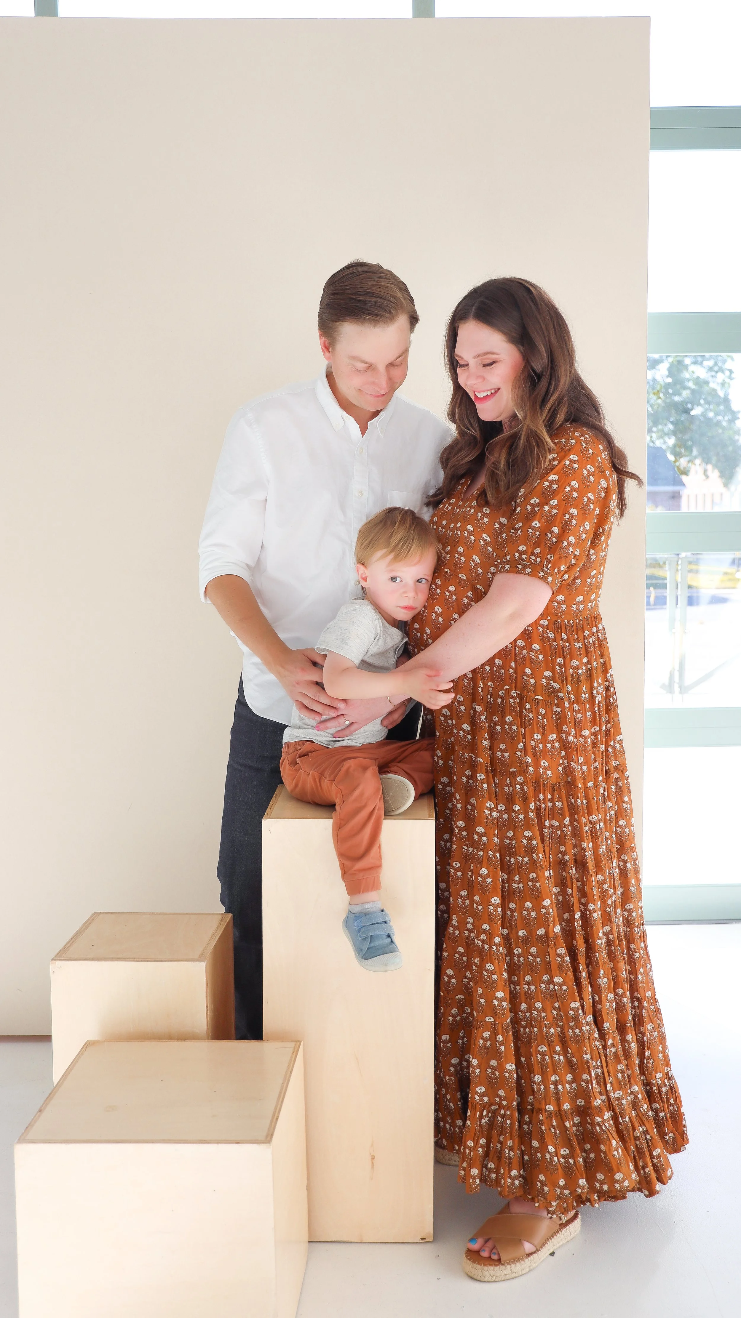 Youngblade family, captured in beautiful maternity photos, eagerly expanding to four. Precious moments in family and maternity photography."