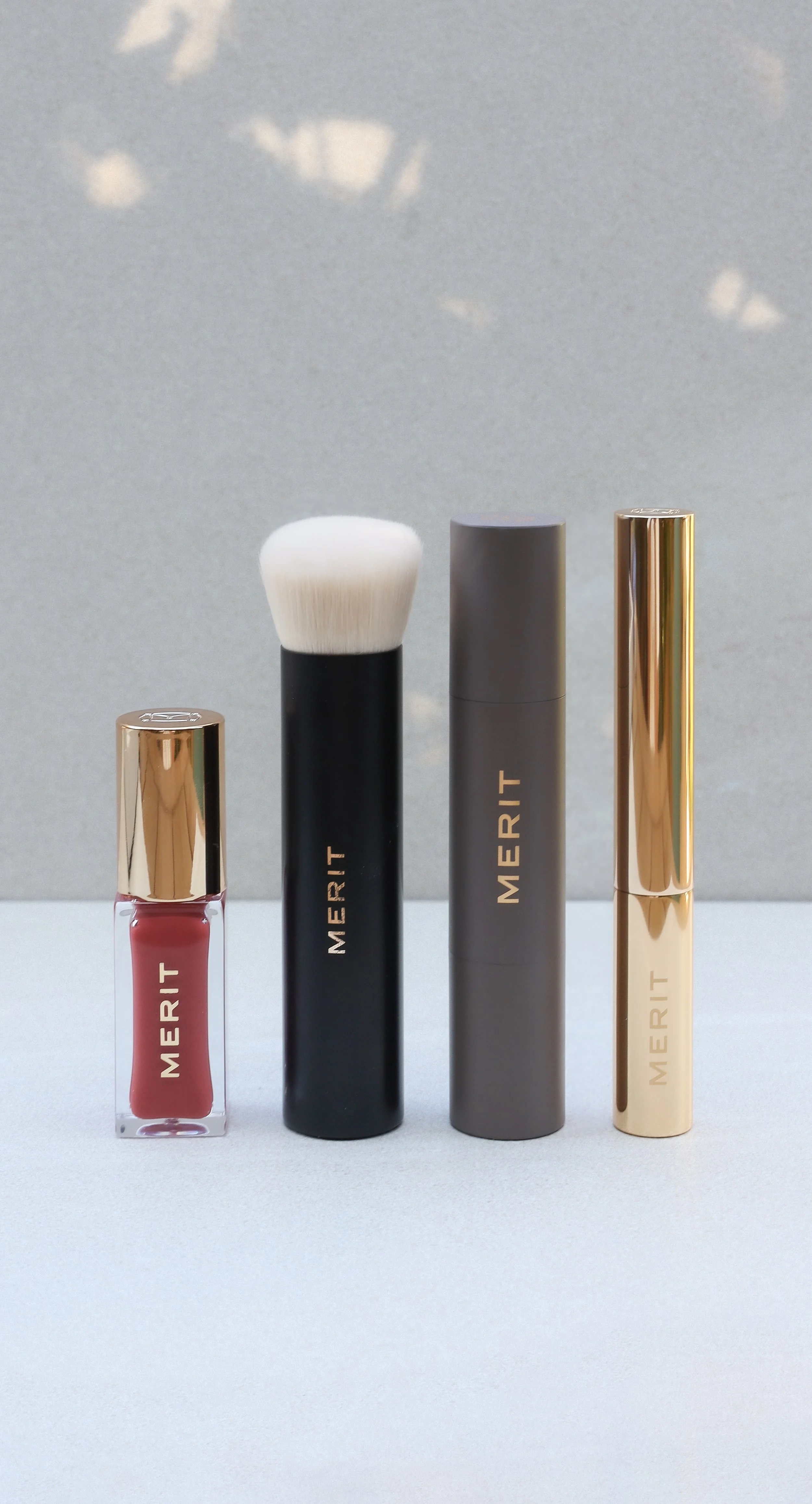 Merit Beauty lip stain, brow gel, concealer and blending brush by Nicole Schmiedl
