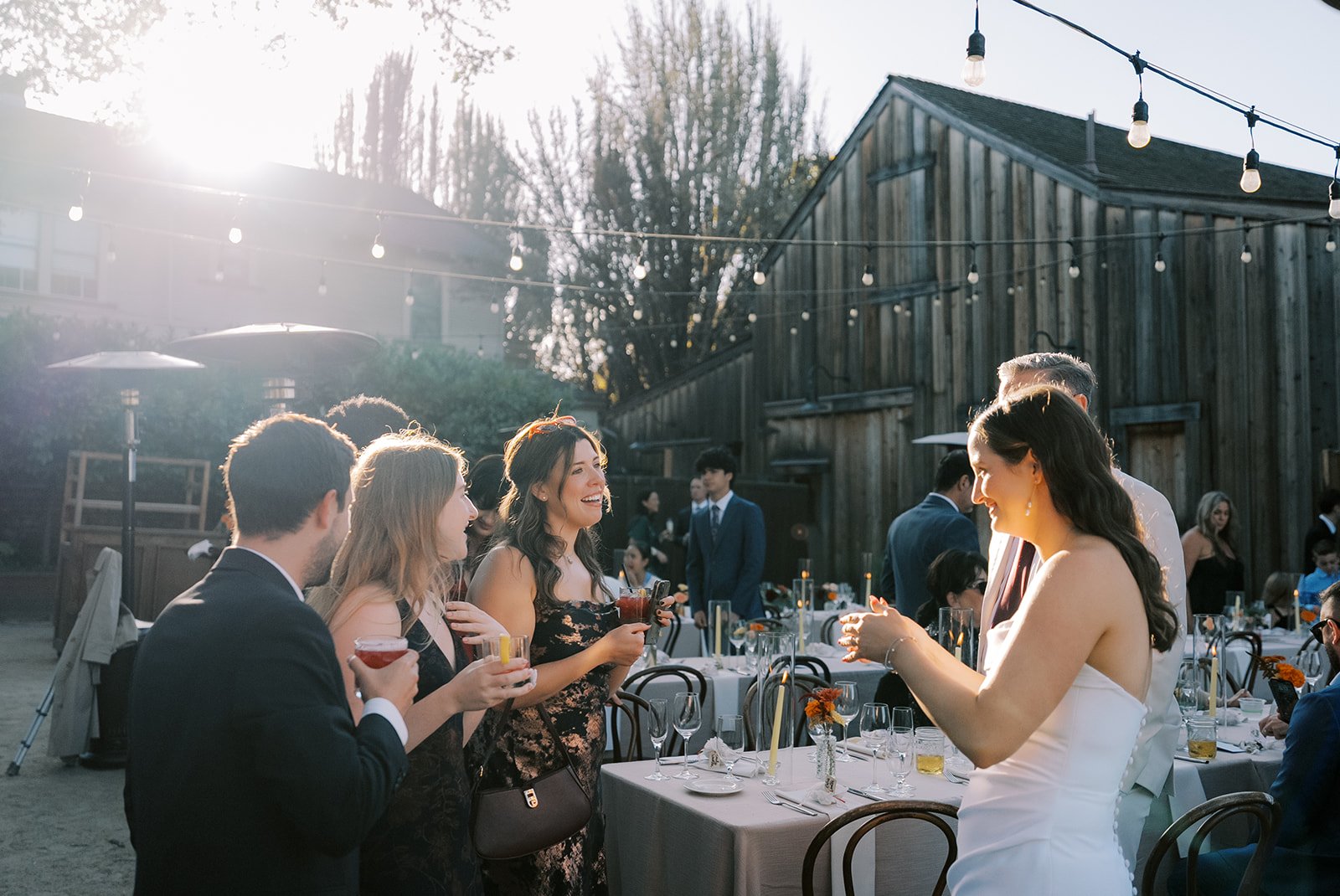 Wedding guests mingling during cocktail hour with curated wedding DJ music setting the tone