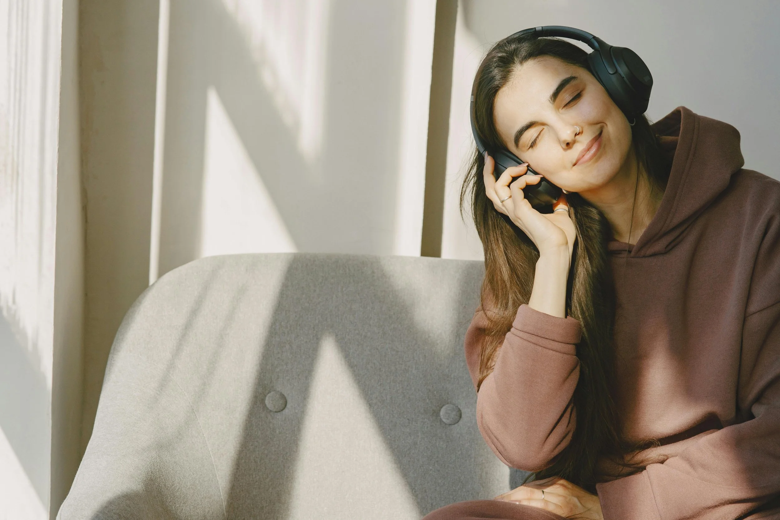 Woman relaxing with headphones listening to music
