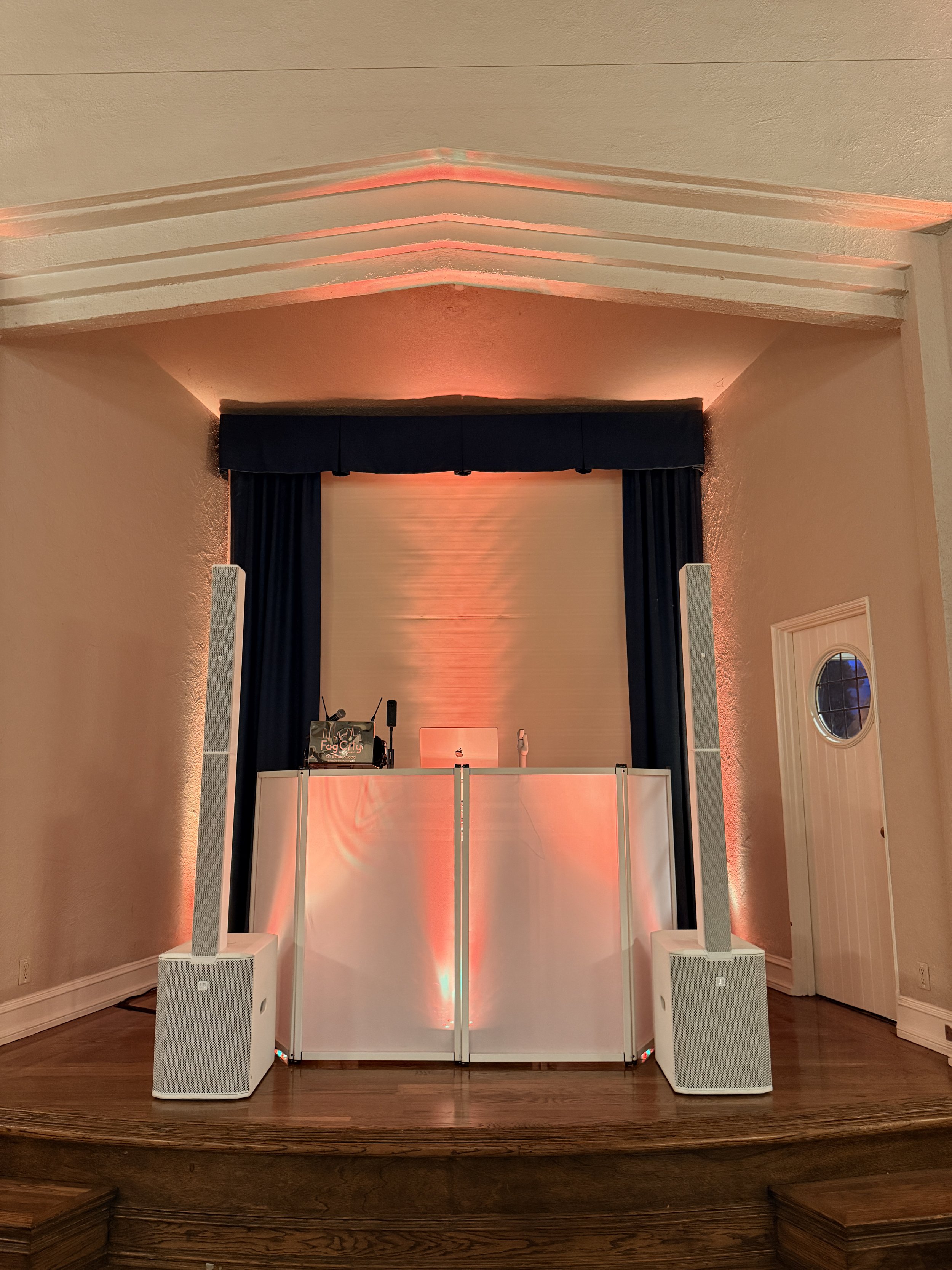 Close-up of Fog City Entertainment DJ booth setup at a destination wedding reception.