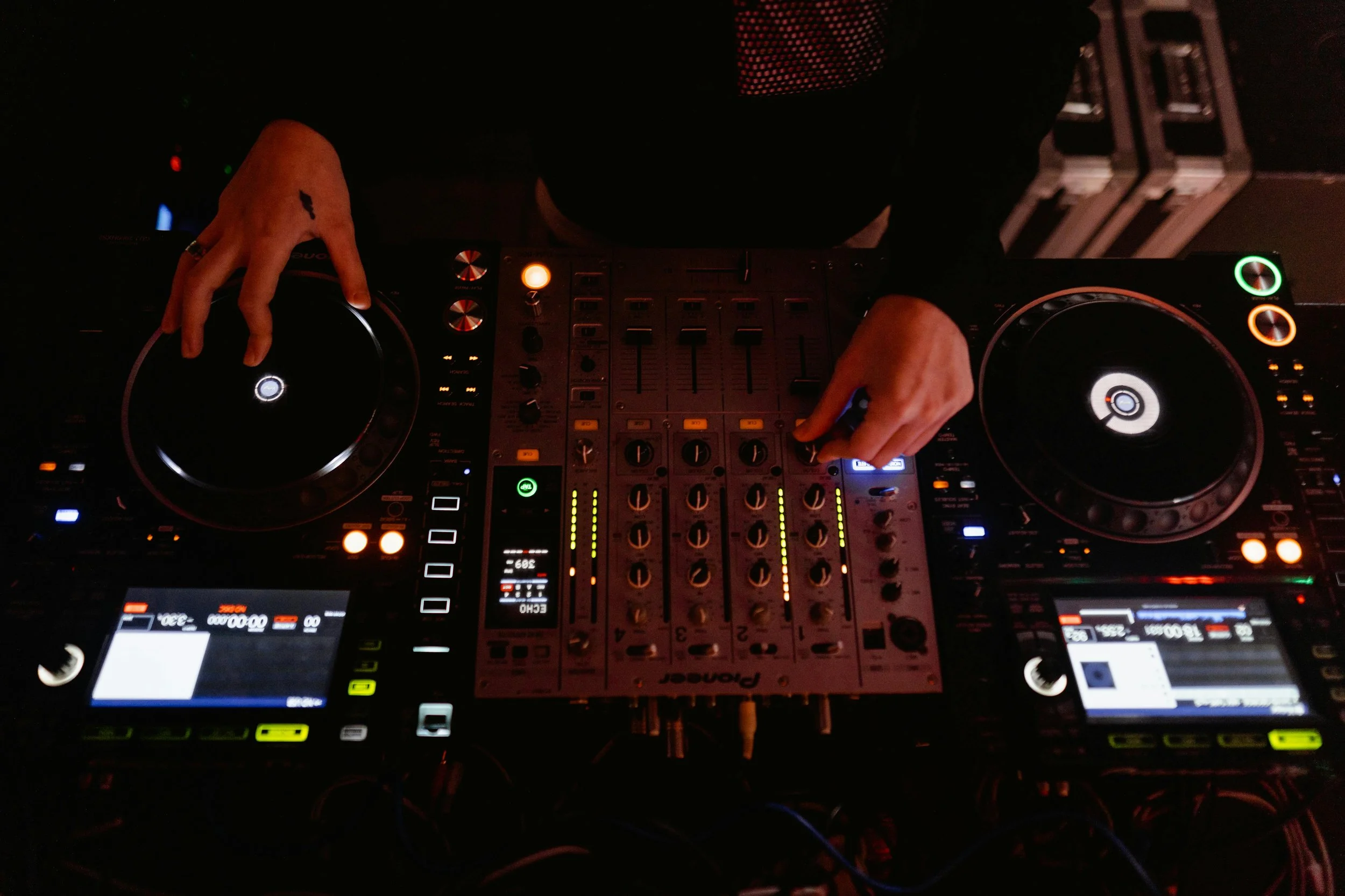 DJ mixing music on professional controller