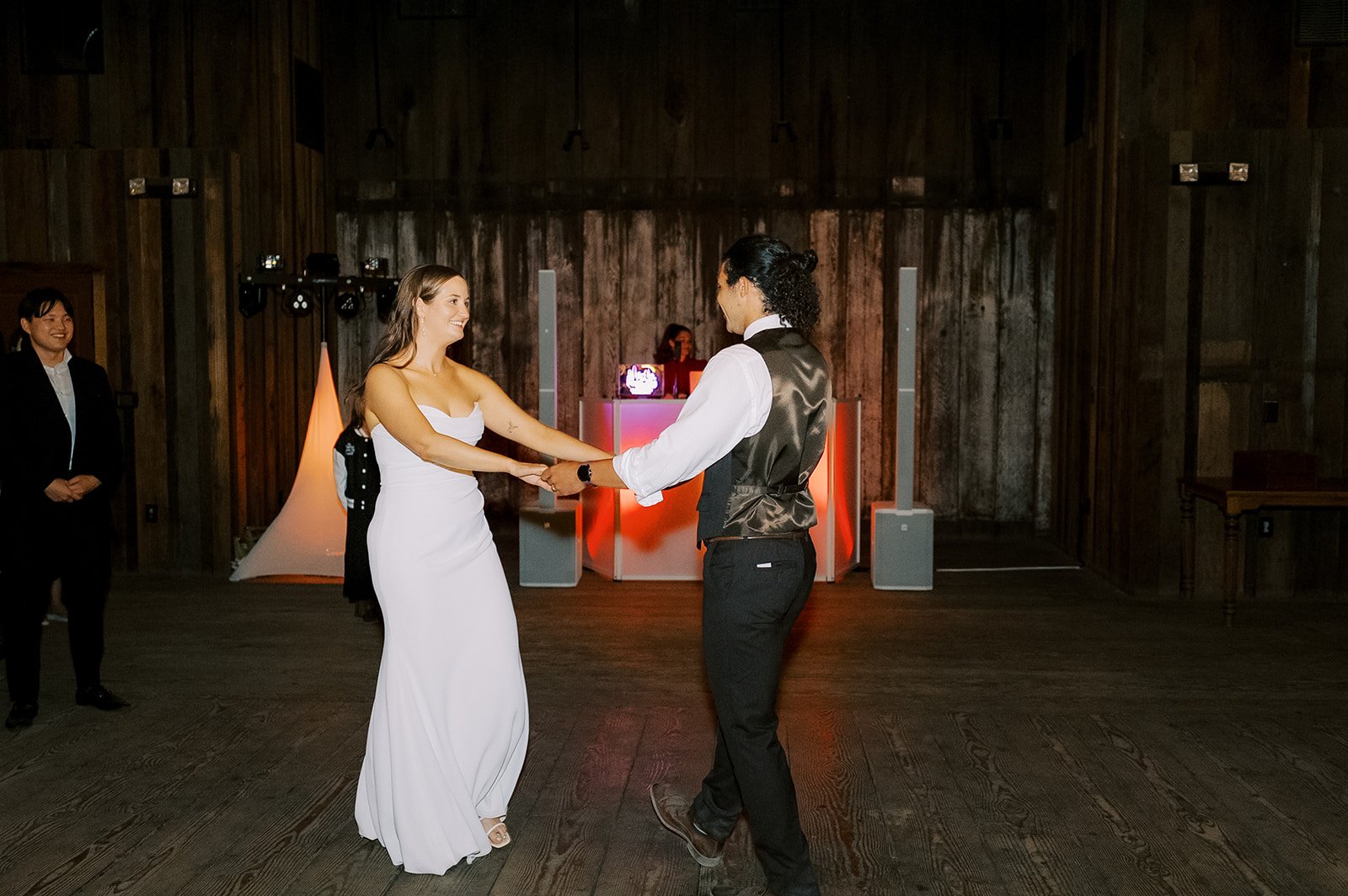 Bride and groom sharing their first dance to a meaningful wedding tracklist