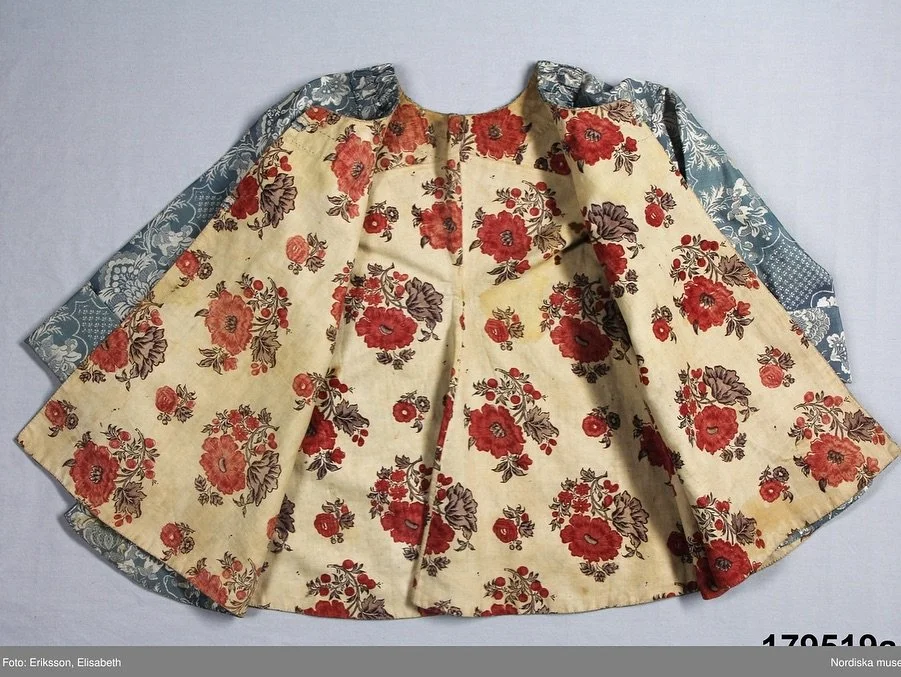 U is for Upcycling

This exquisite ice-blue, two-piece jacket and skirt from the Nordiska Museet in Sweden began life as a luxurious robe &agrave; la fran&ccedil;aise, crafted from richly brocaded silk that would have been very costly and saved for b