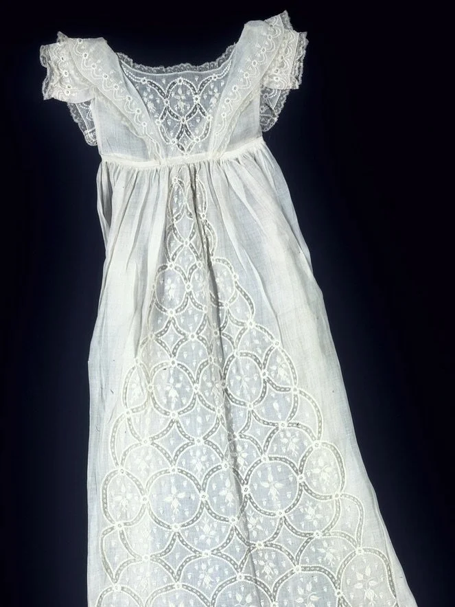 This 19th-century French christening gown is held by the Cooper Hewitt, Smithsonian Design Museum. Dated to between 1875–1900, it is made from fine linen and cotton and embroidered in whitework, a painstaking technique likely executed by a moth