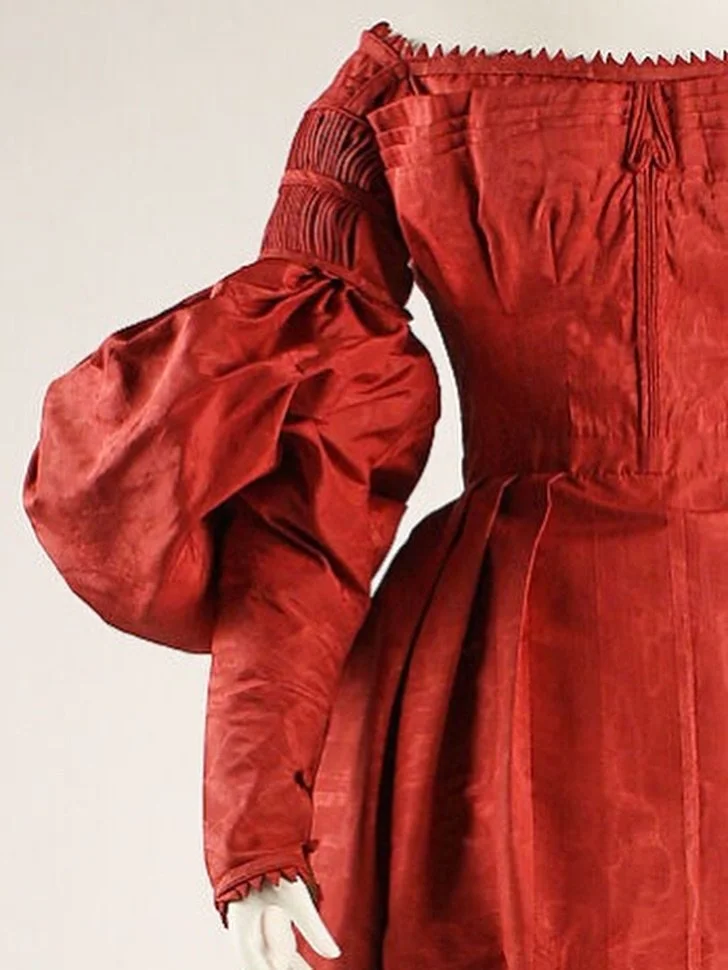 There&rsquo;s something about this 1837 moir&eacute; silk gown from the @metmuseum that always captures my heart. First comes the smouldering red, but lean in closer and there&rsquo;s so much more. There are vertical pleats along the upper arm and hu