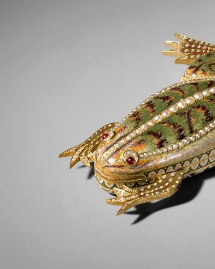 Yesterday we looked at a 17th‑century frog purse; today we leap‑frog two hundred years forward to something far more mechanical.

This Swiss automaton, made around 1820 and now at The Met, is a tiny frog in gold and green enamel, set with pearls and 
